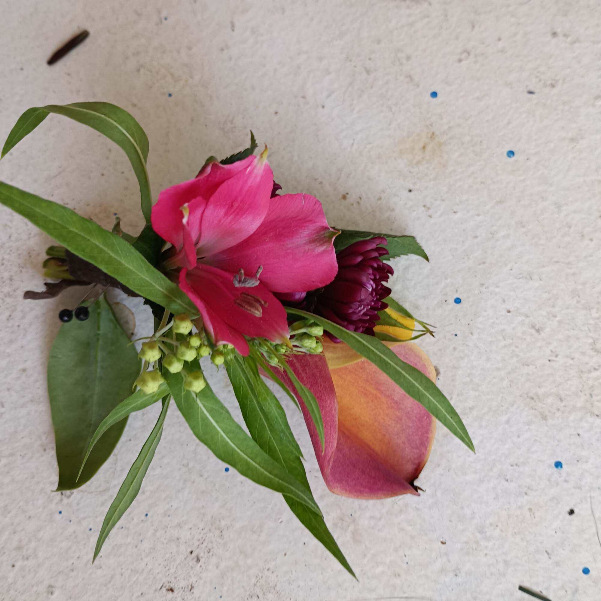 Beautiful sunset - orange mini calla lily and filler flowers boutonniere