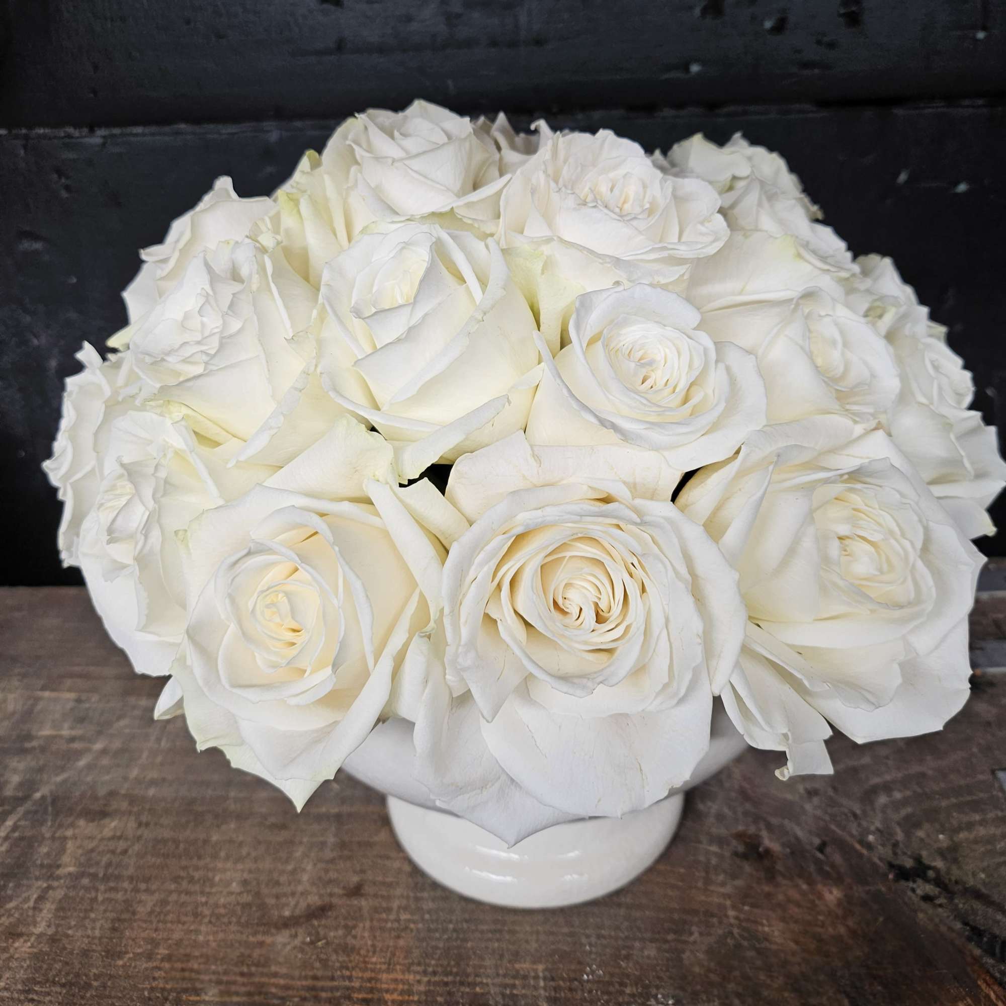 Pure and elegant, this arrangement features an abundance of premium white roses Pure and elegant, this arrangement features an abundance of premium white roses