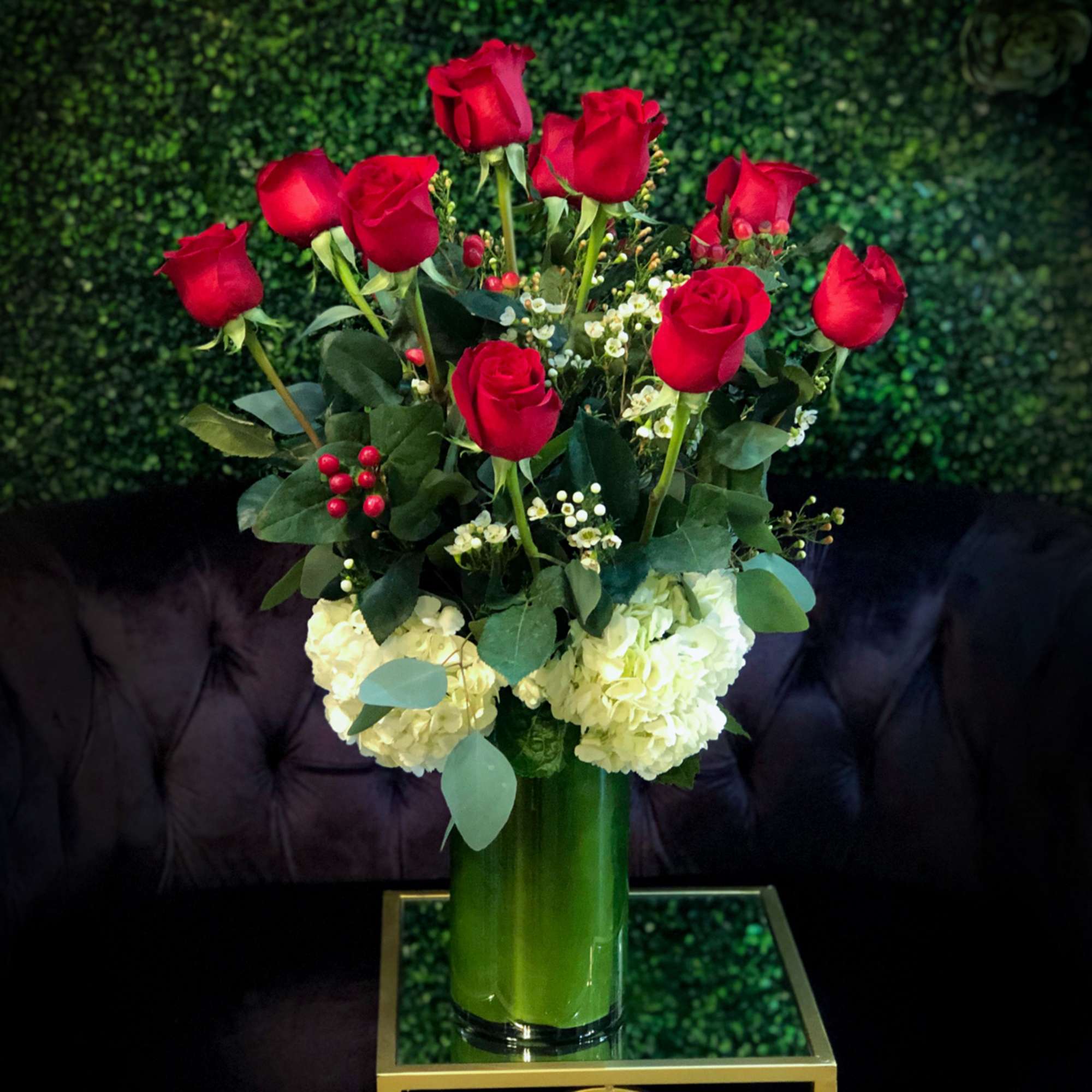 Romanza Italia is made with a dozen roses, hydrangea, seasonal greenery, and