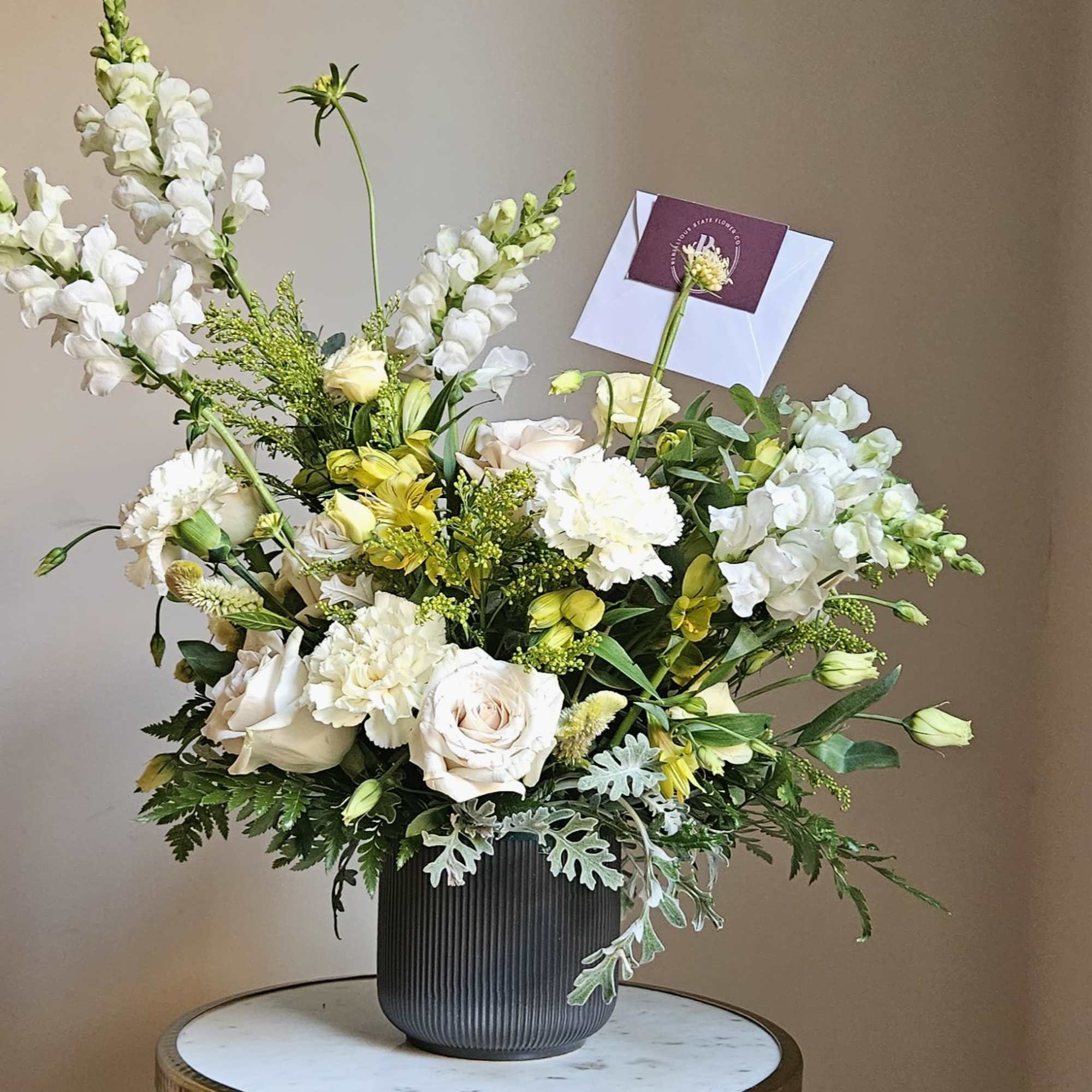 This vase arrangement is designed in Rebellious State&#039;s signature style with layers