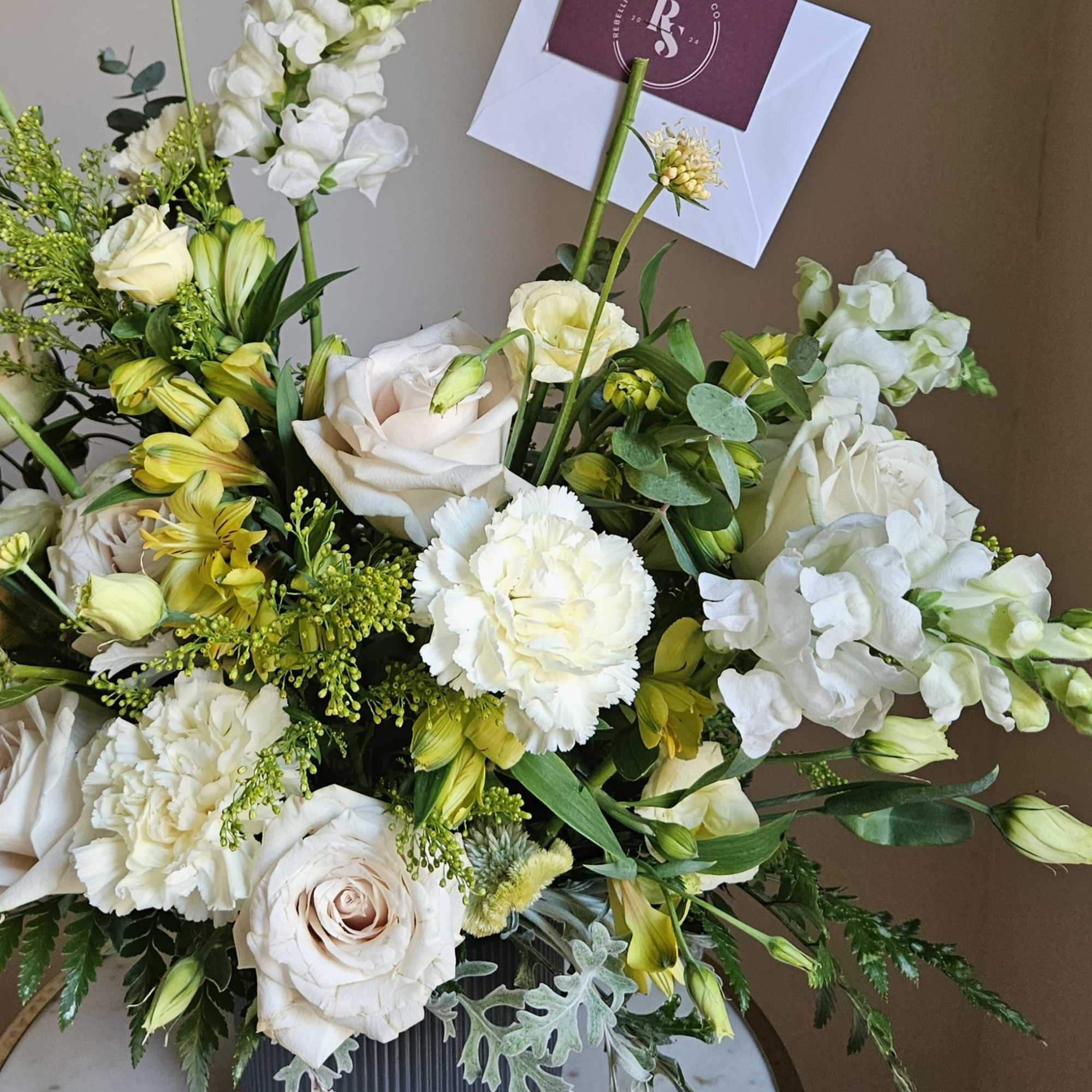 This vase arrangement is designed in Rebellious State&#039;s signature style with layers