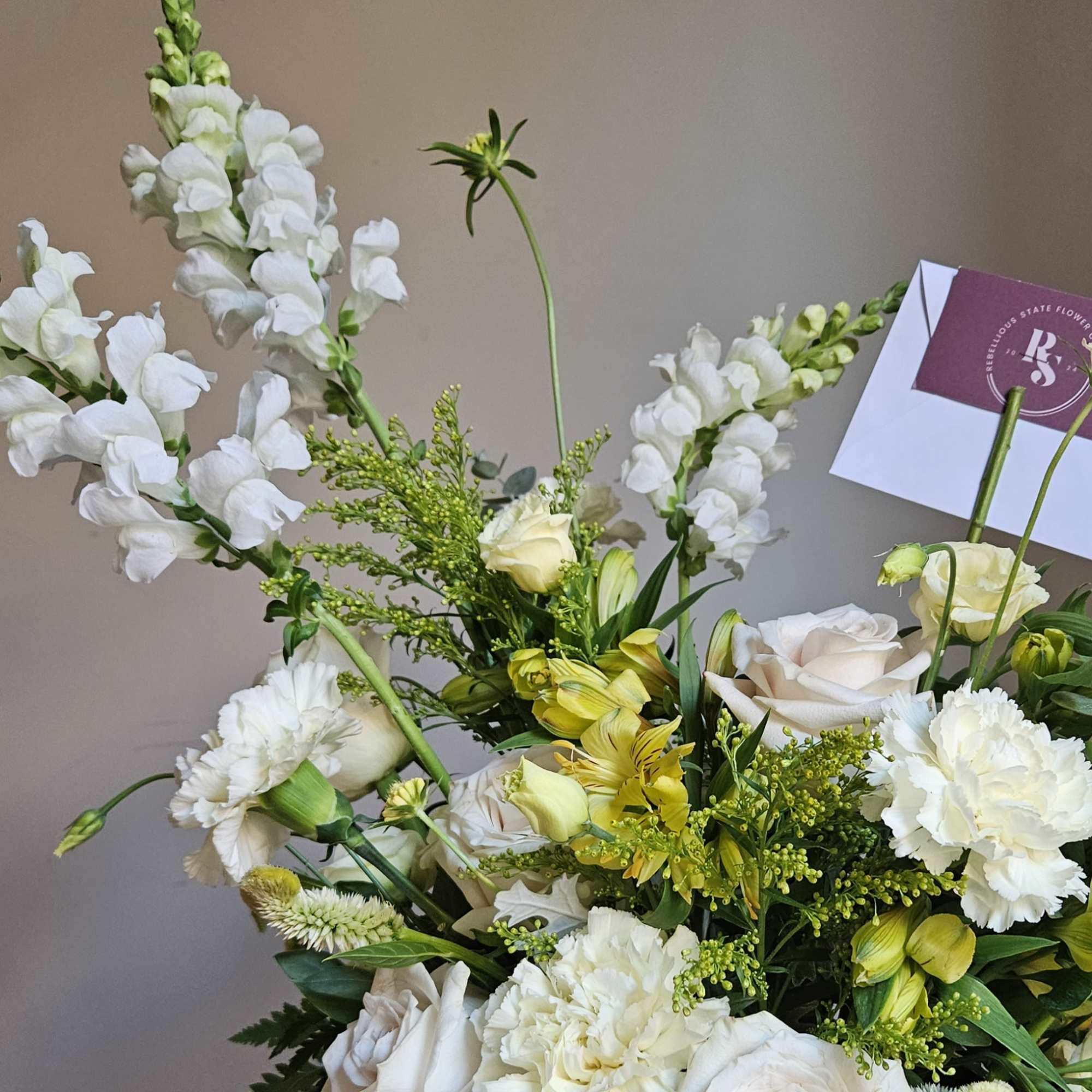 This vase arrangement is designed in Rebellious State&#039;s signature style with layers