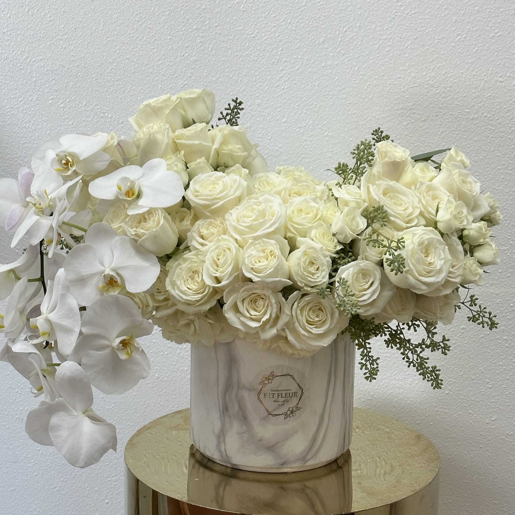 Bring beauty to the table with elegant arrangement, presented in a round