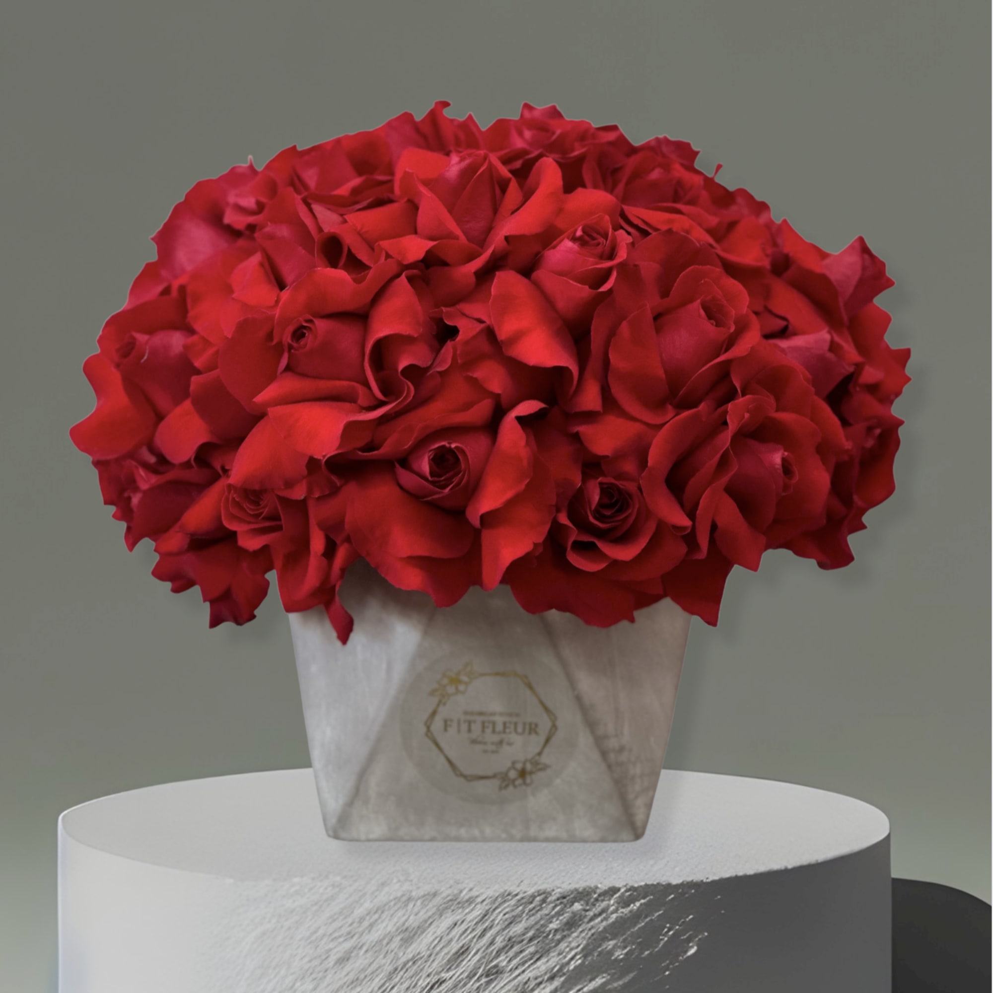 Introducing our **Concrete Elegance** arrangement &ndash; a stunning display of red roses