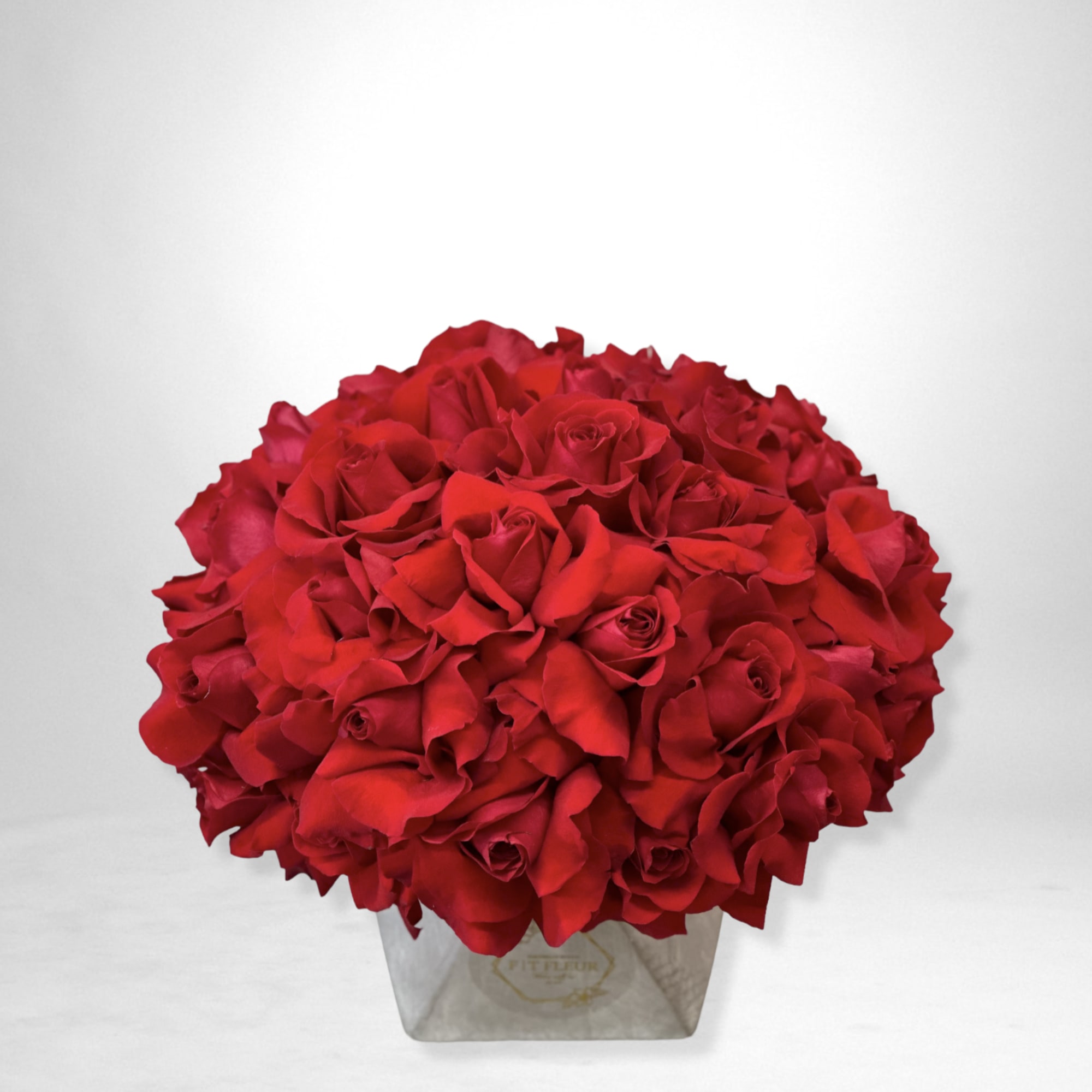 Introducing our **Concrete Elegance** arrangement &ndash; a stunning display of red roses