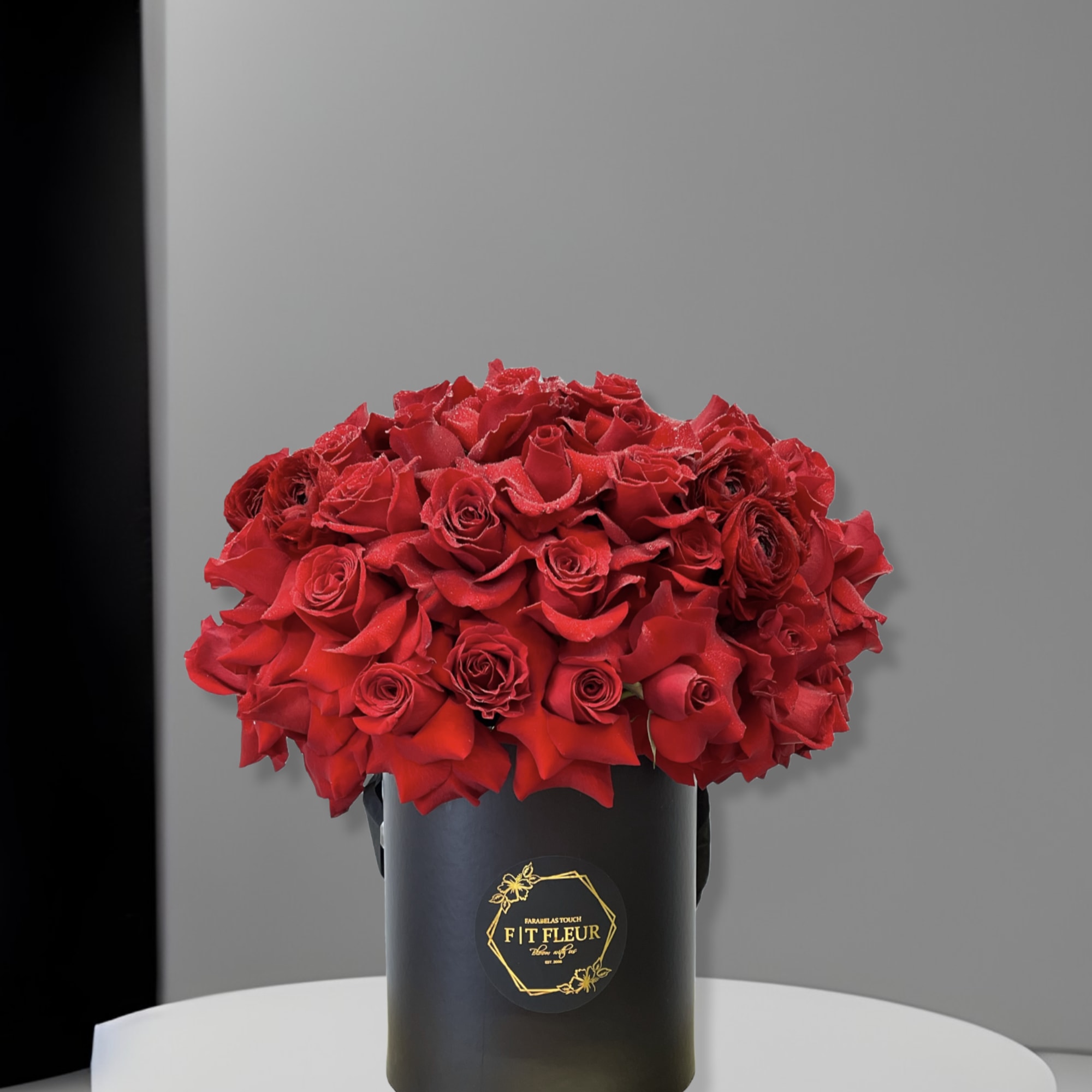 Introducing **Red Ruby Reflection**, a stunning floral arrangement presented in a sleek