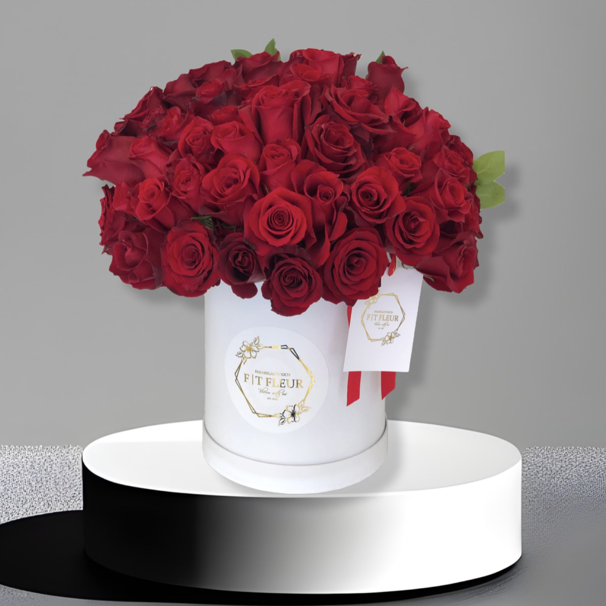 Introducing **50 Red Roses in a Hat Box**, a stunning and whimsical