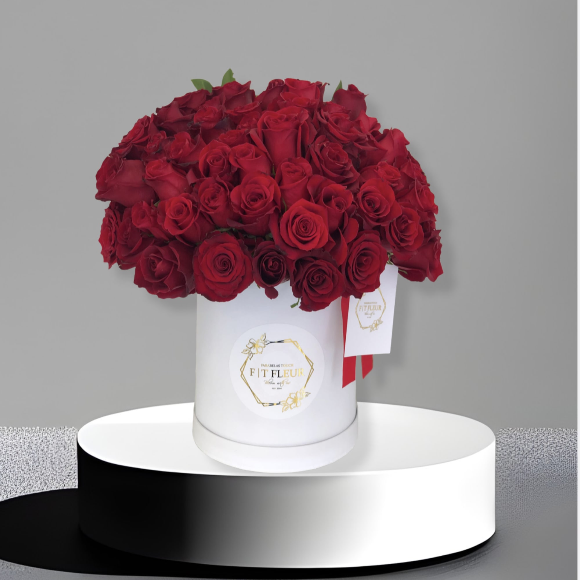 Introducing **50 Red Roses in a Hat Box**, a stunning and whimsical