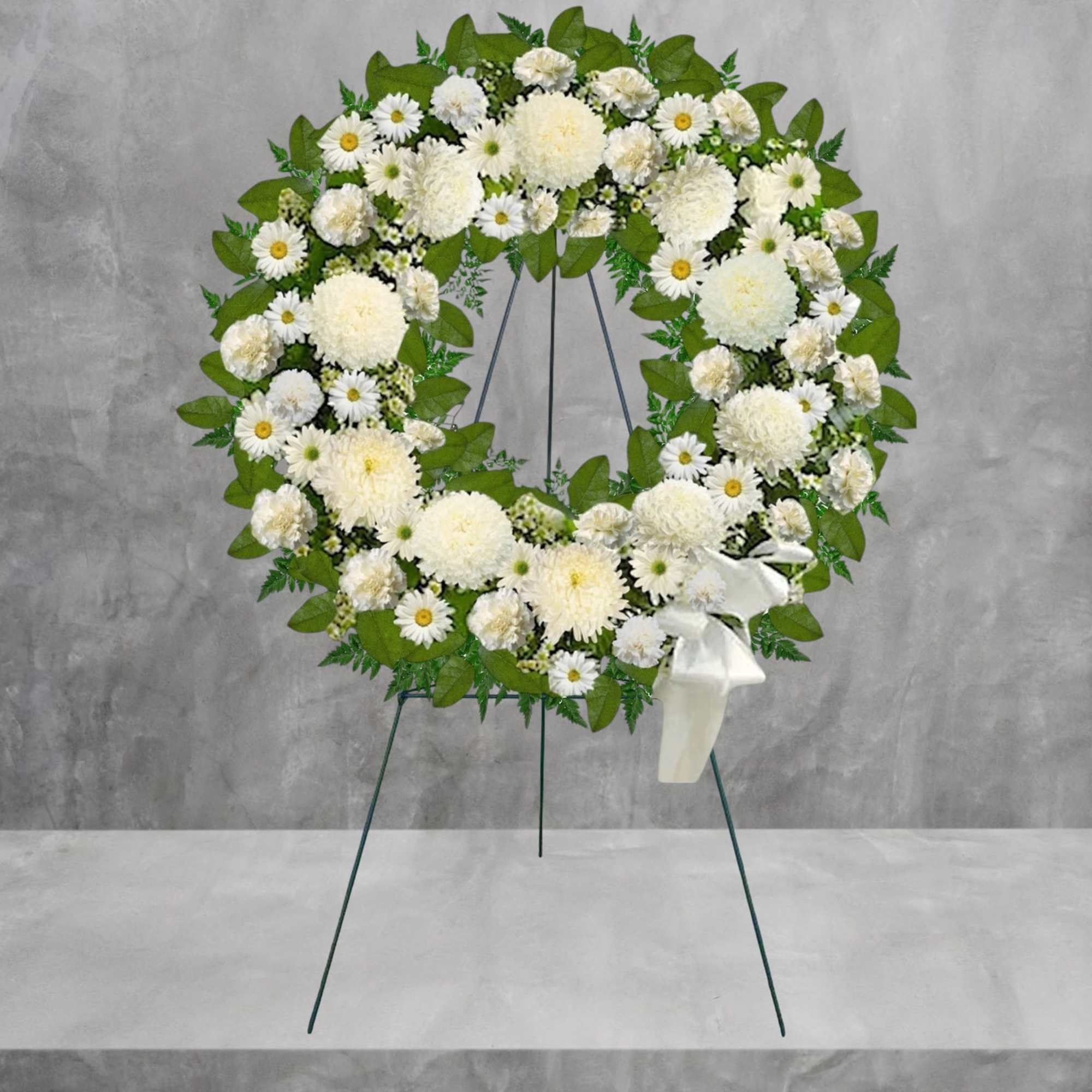 A beautiful white wreath symbolizes the circle of eternal life. Our standing