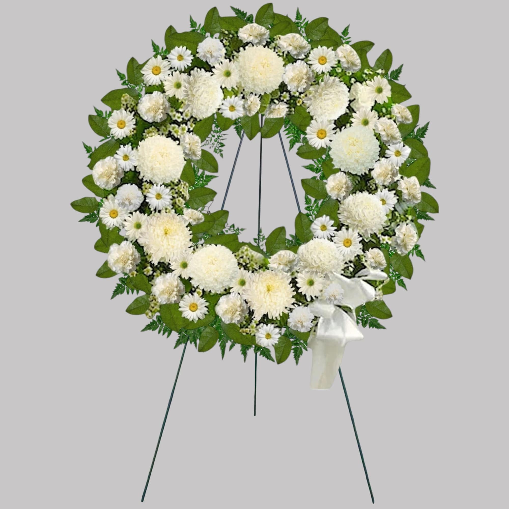 A beautiful white wreath symbolizes the circle of eternal life. Our standing