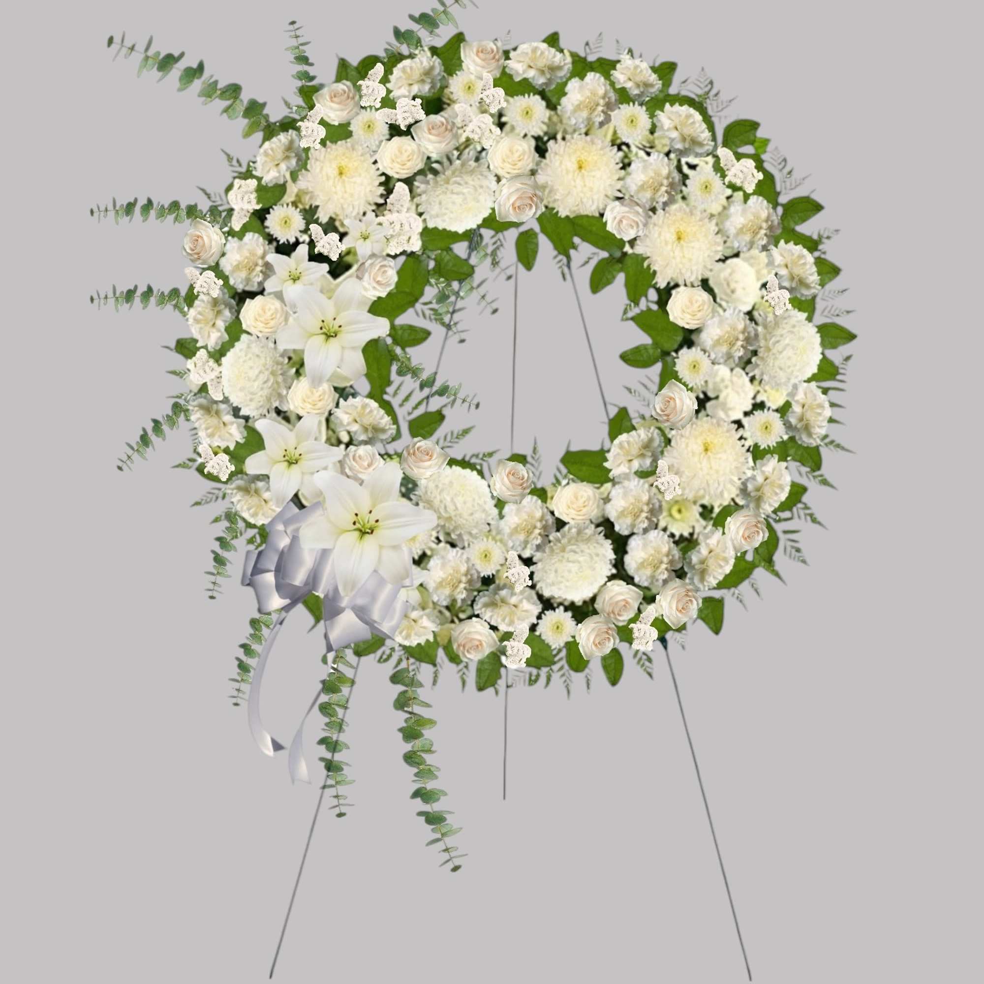 A beautiful white wreath symbolizes the circle of eternal life. Our standing