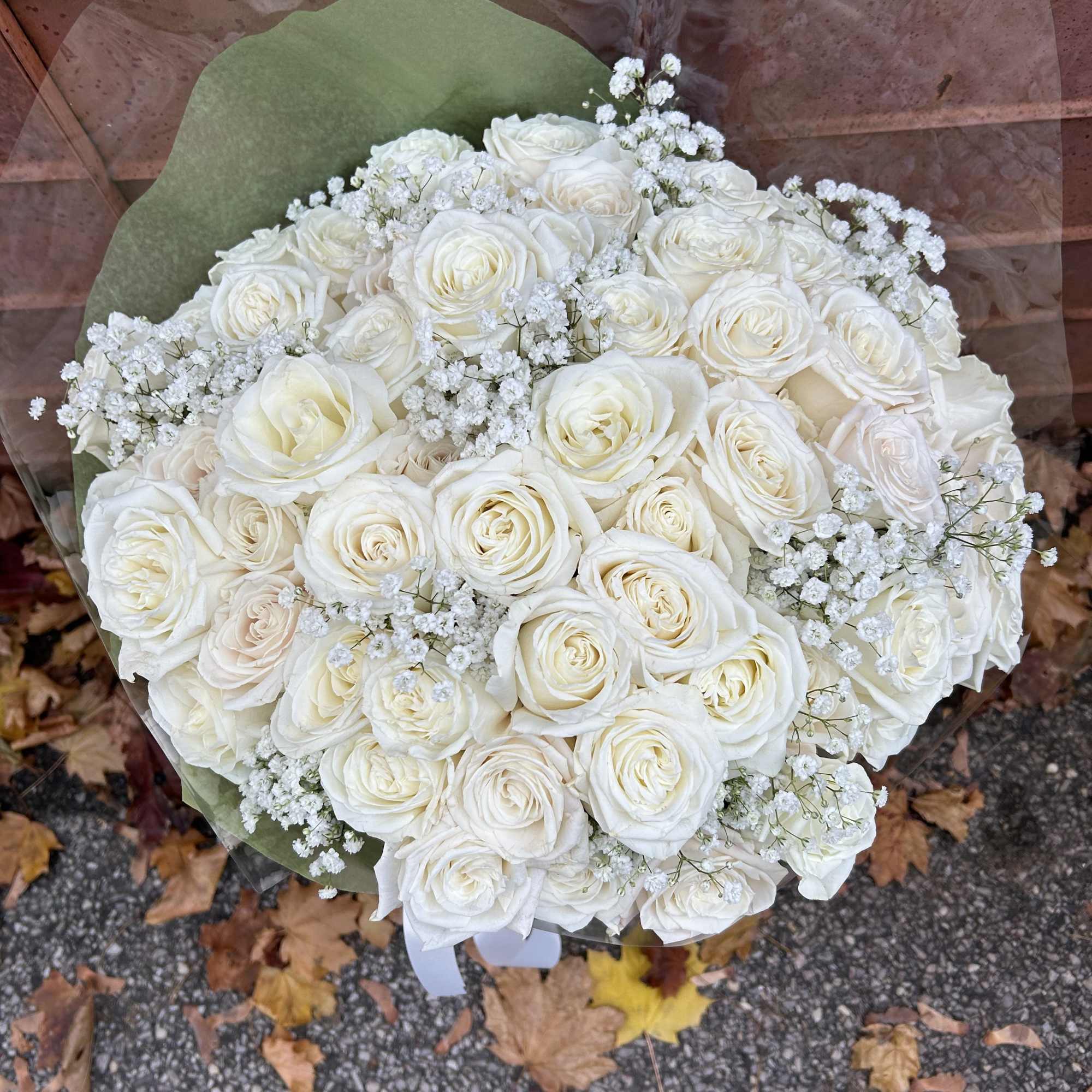 A sophisticated bunch of fresh cut flowers made up of white roses