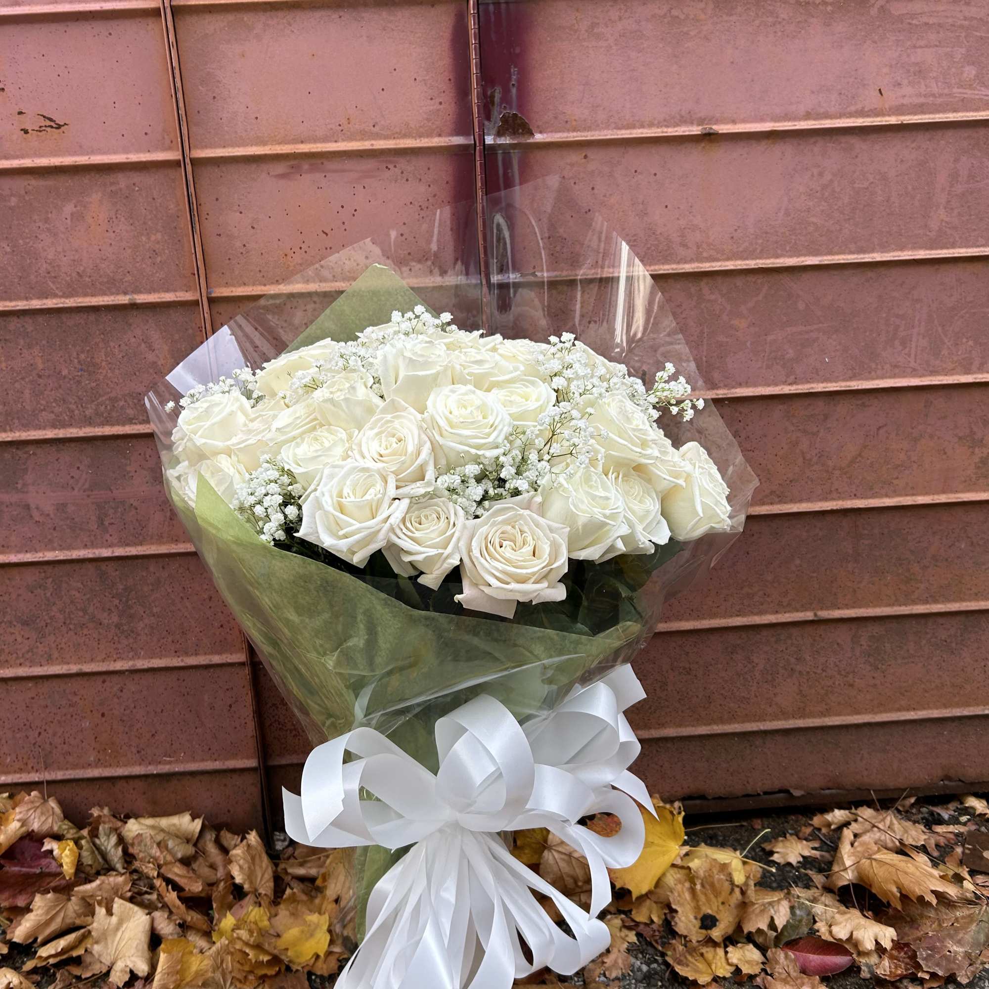A sophisticated bunch of fresh cut flowers made up of white roses