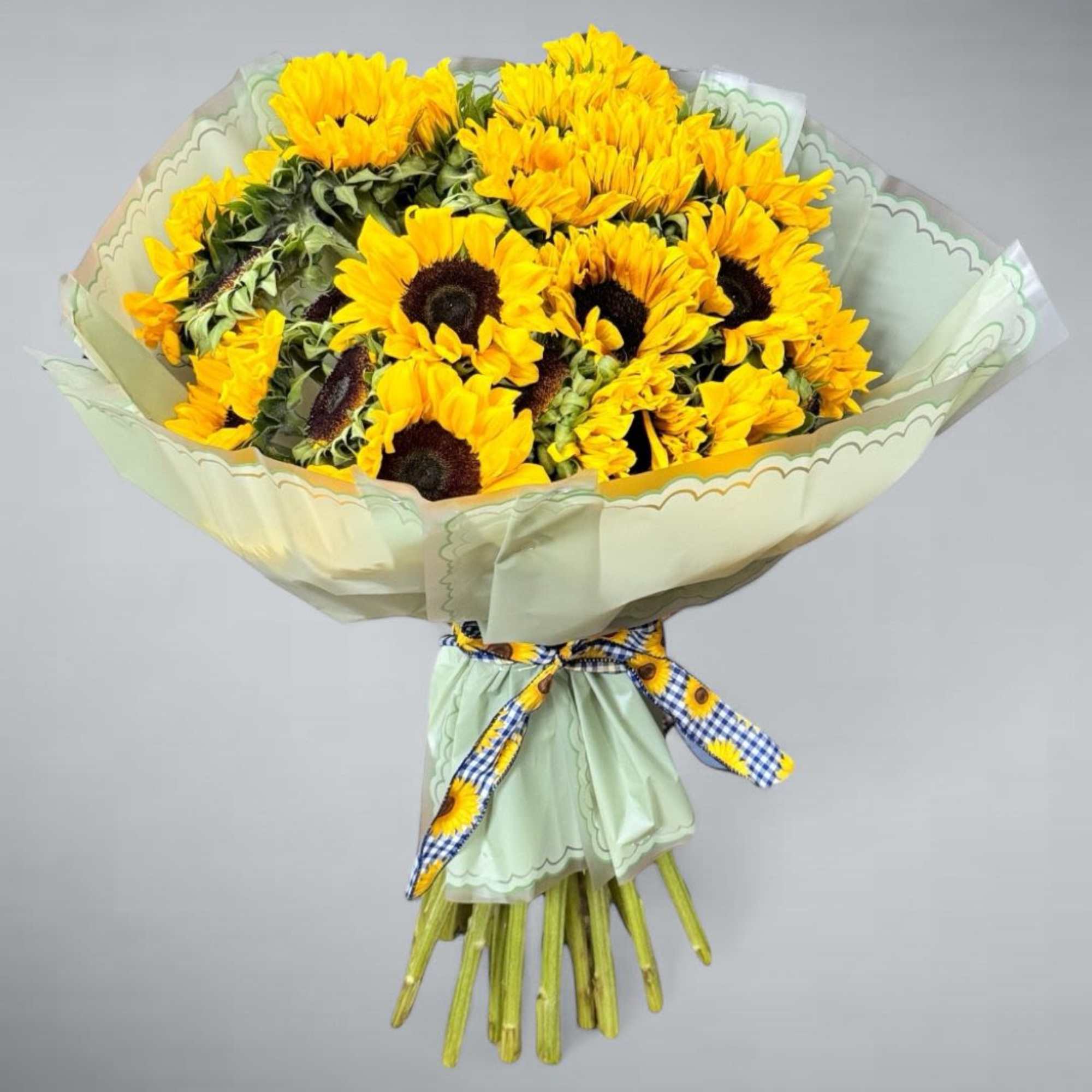 A beautiful arrangement of sunflowers, elegant and casual for your favorite person.
