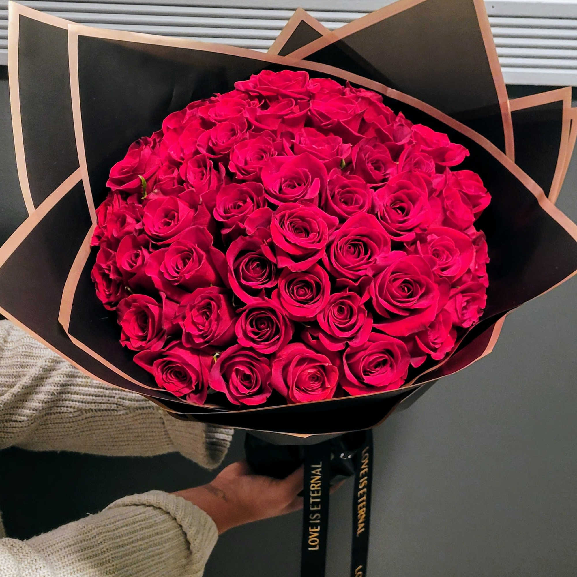 The Eternal Amour Bouquet featuring 50 red roses is the ultimate expression