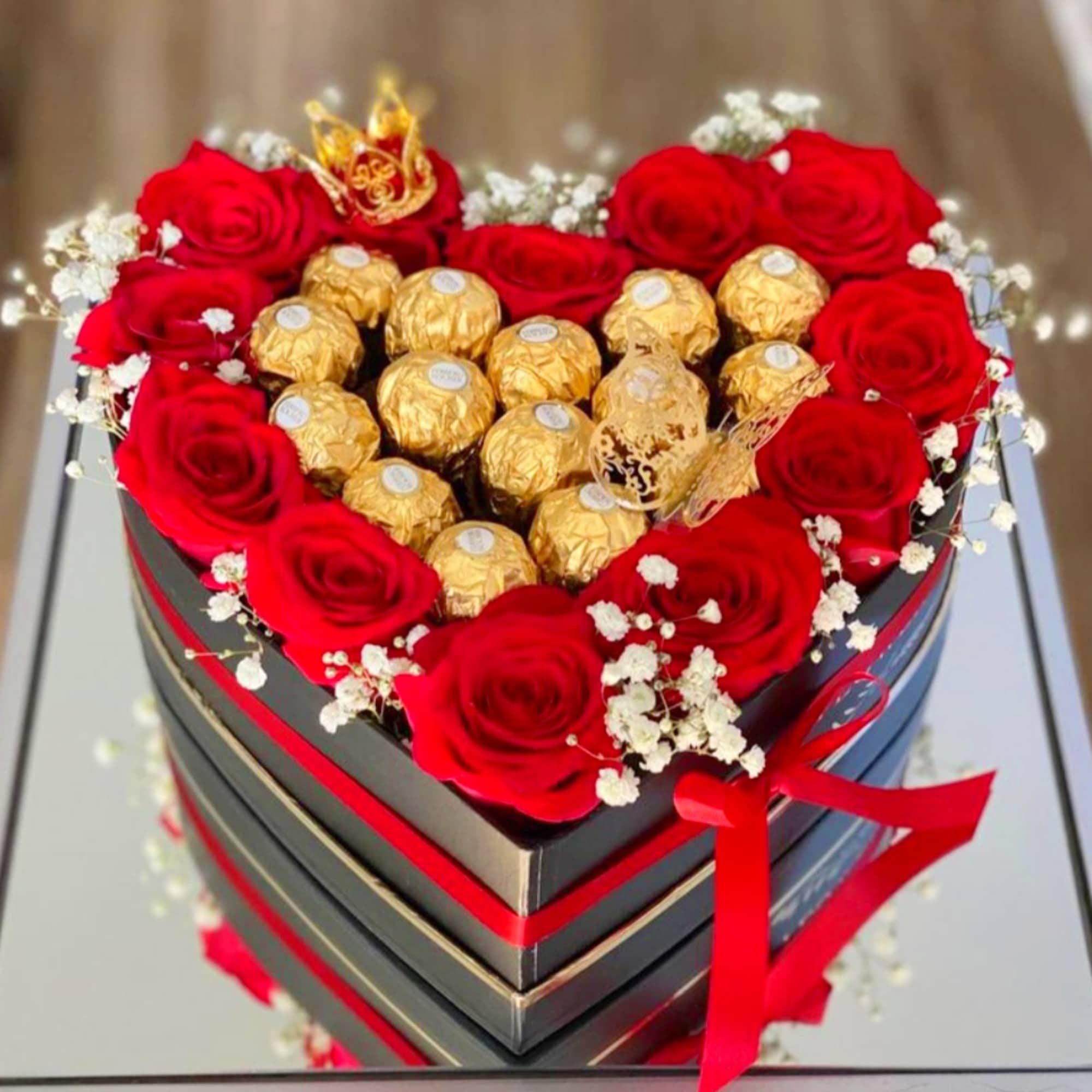 We will custom design a heart shaped centerpiece with roses and ferrero We will custom design a heart shaped centerpiece with roses and ferrero