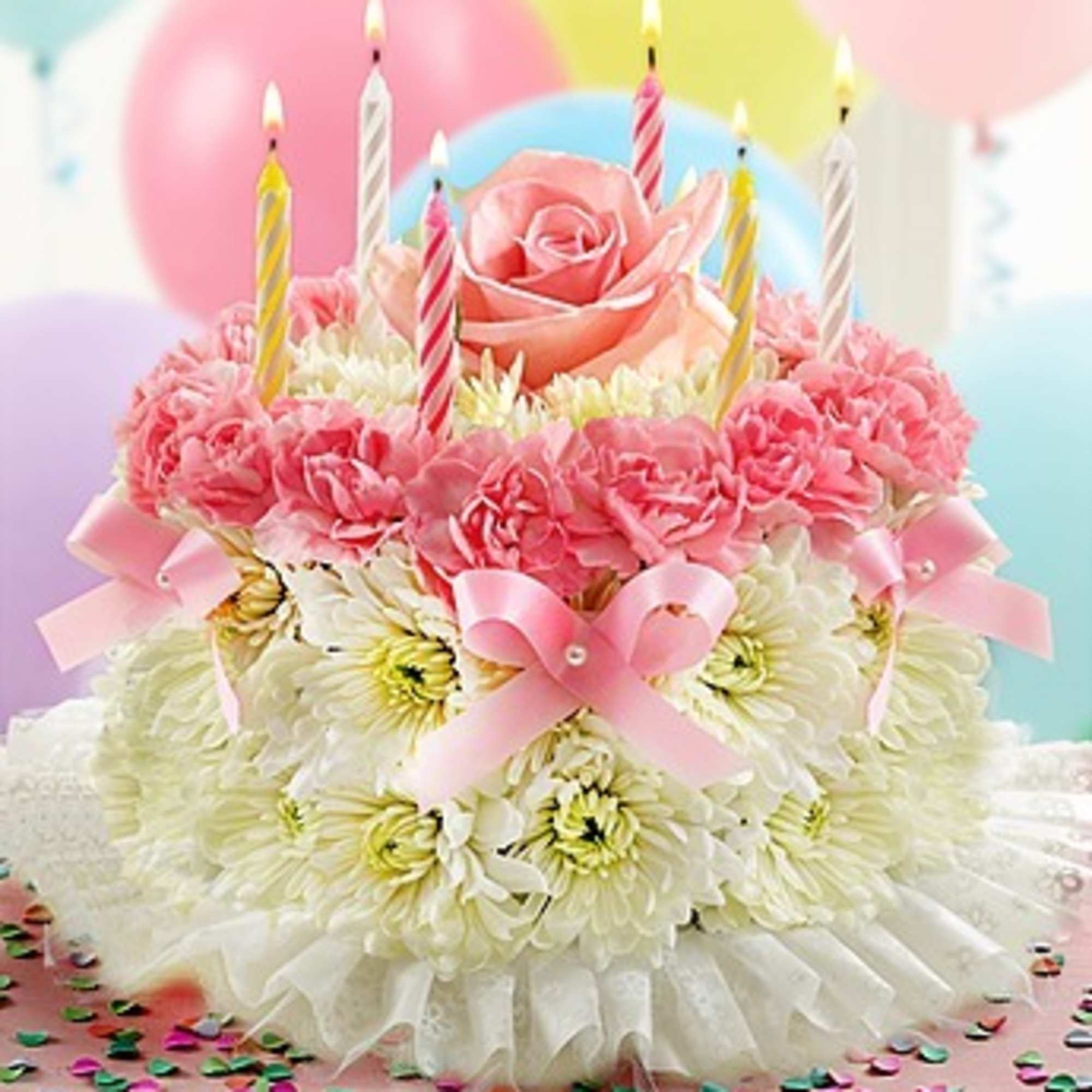 Birthday Flower Cake is made of fresh flower blooms and birthday candles