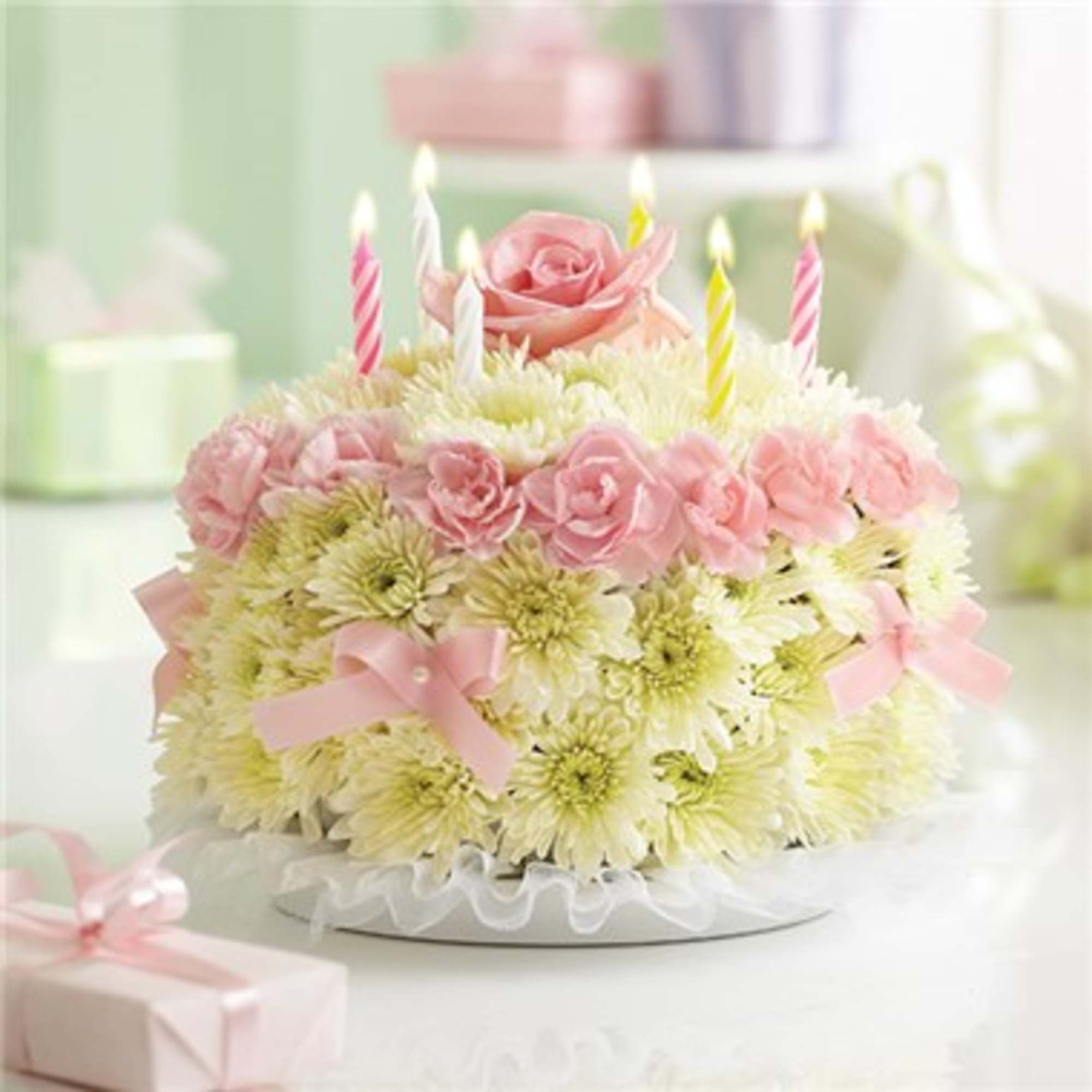 Birthday Flower Cake is made of fresh flower blooms and birthday candles