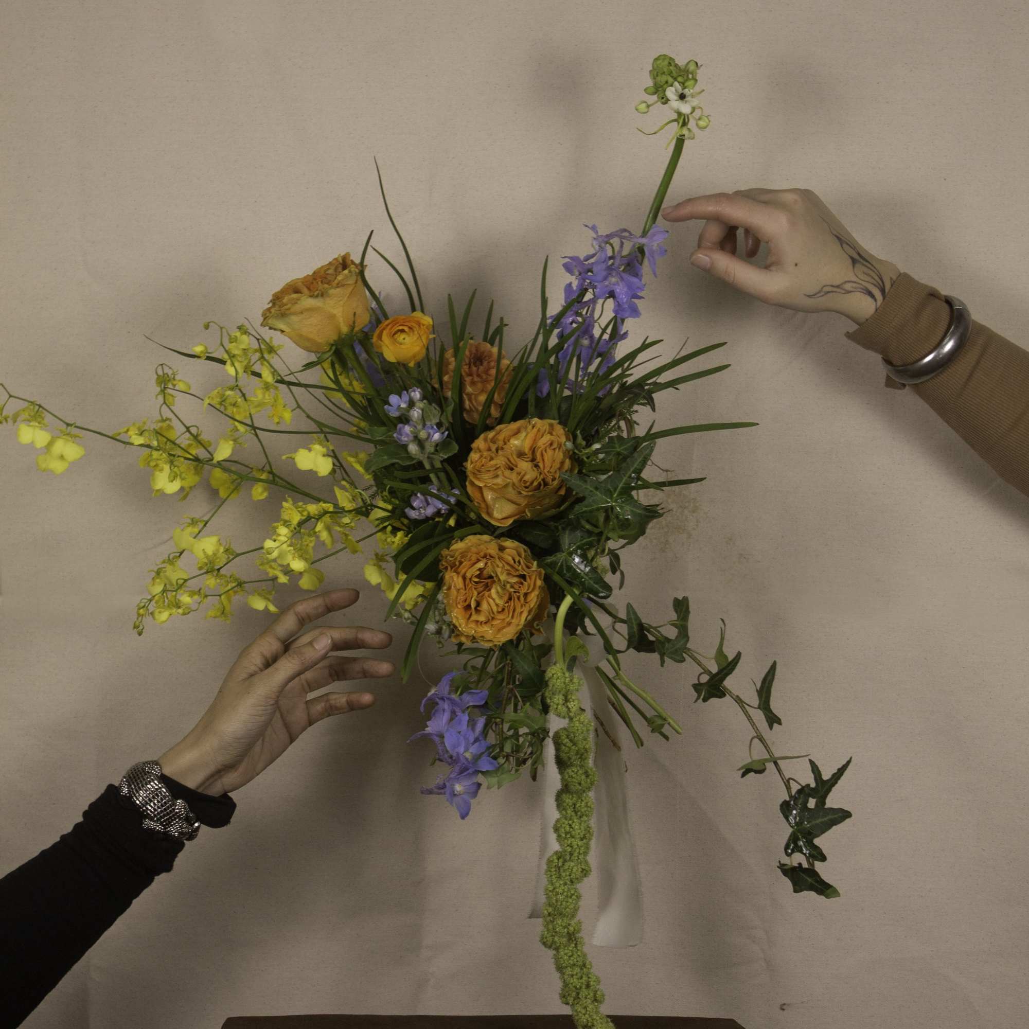 &quot;Keighley&quot; is a striking hand-tied bouquet, blending vibrant hues with elegant textures.