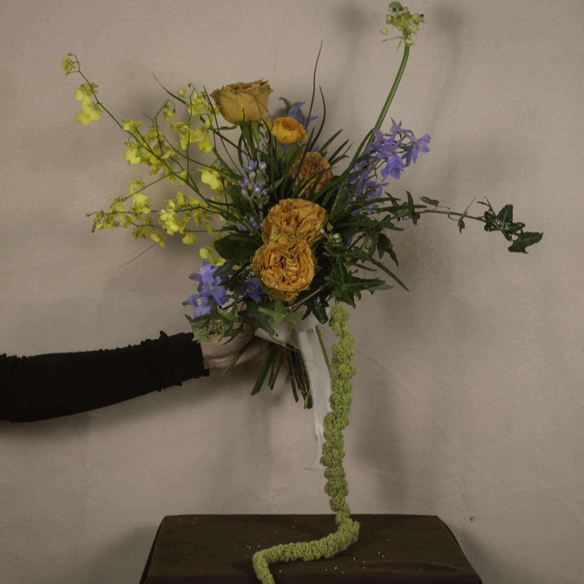 &quot;Keighley&quot; is a striking hand-tied bouquet, blending vibrant hues with elegant textures.