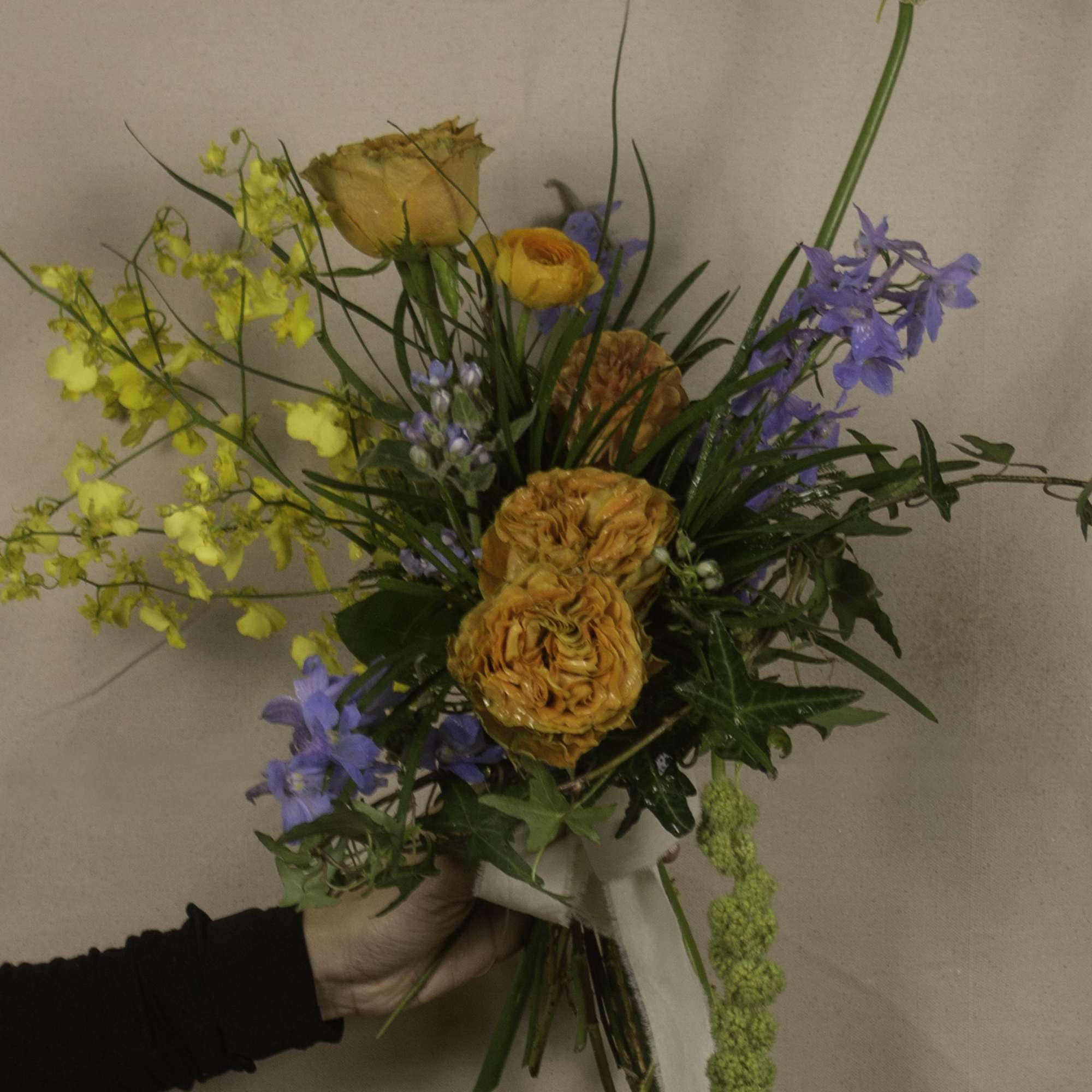 &quot;Keighley&quot; is a striking hand-tied bouquet, blending vibrant hues with elegant textures.