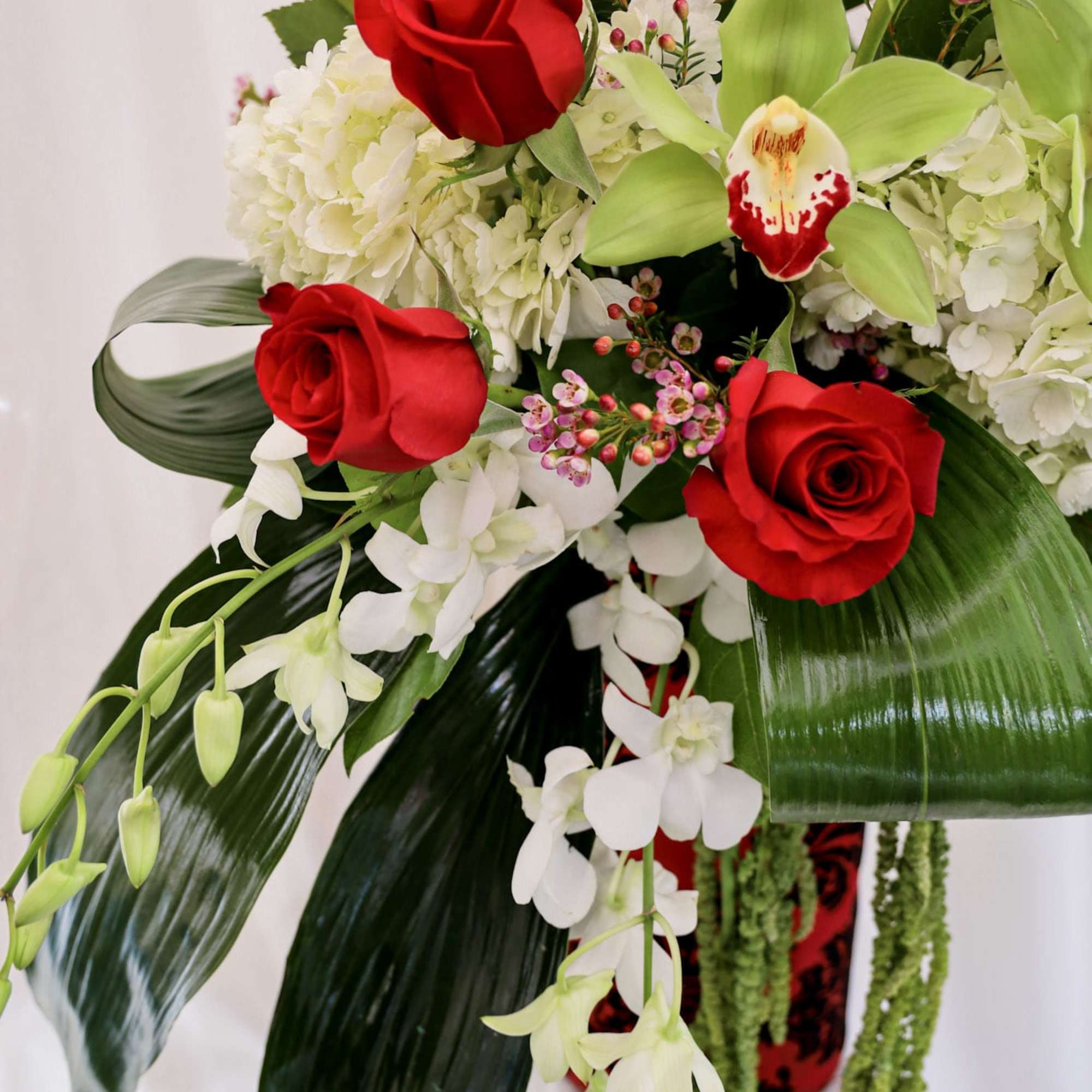 This grand Valentine&#039;s Day arrangement is composed of three dozen roses, hydrangeas