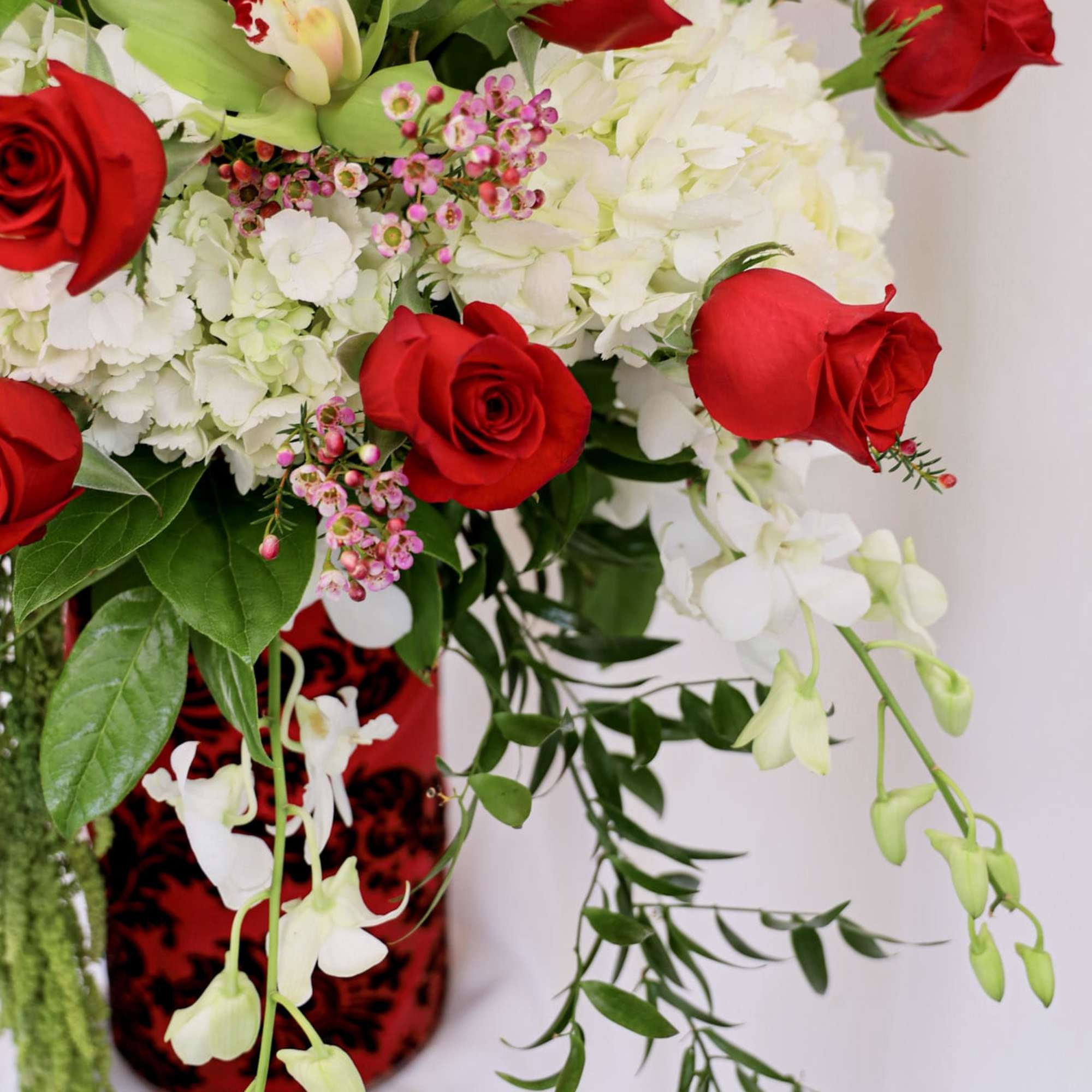 This grand Valentine&#039;s Day arrangement is composed of three dozen roses, hydrangeas