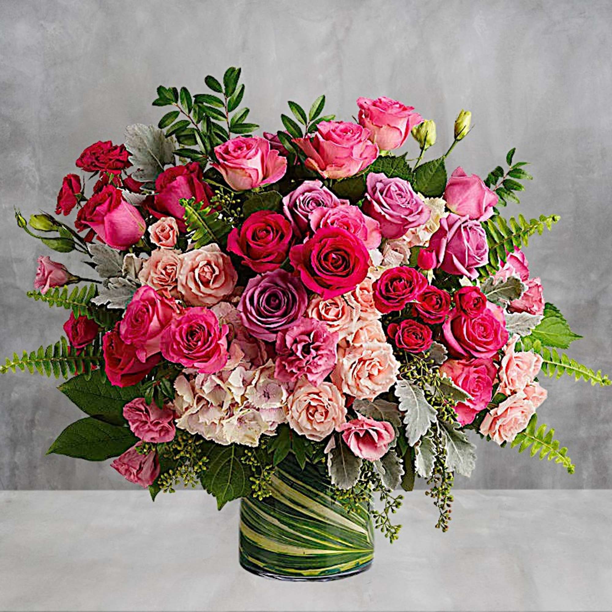 Spoil them rotten with this heavenly, high-fashion rose creation! Ravishing roses in