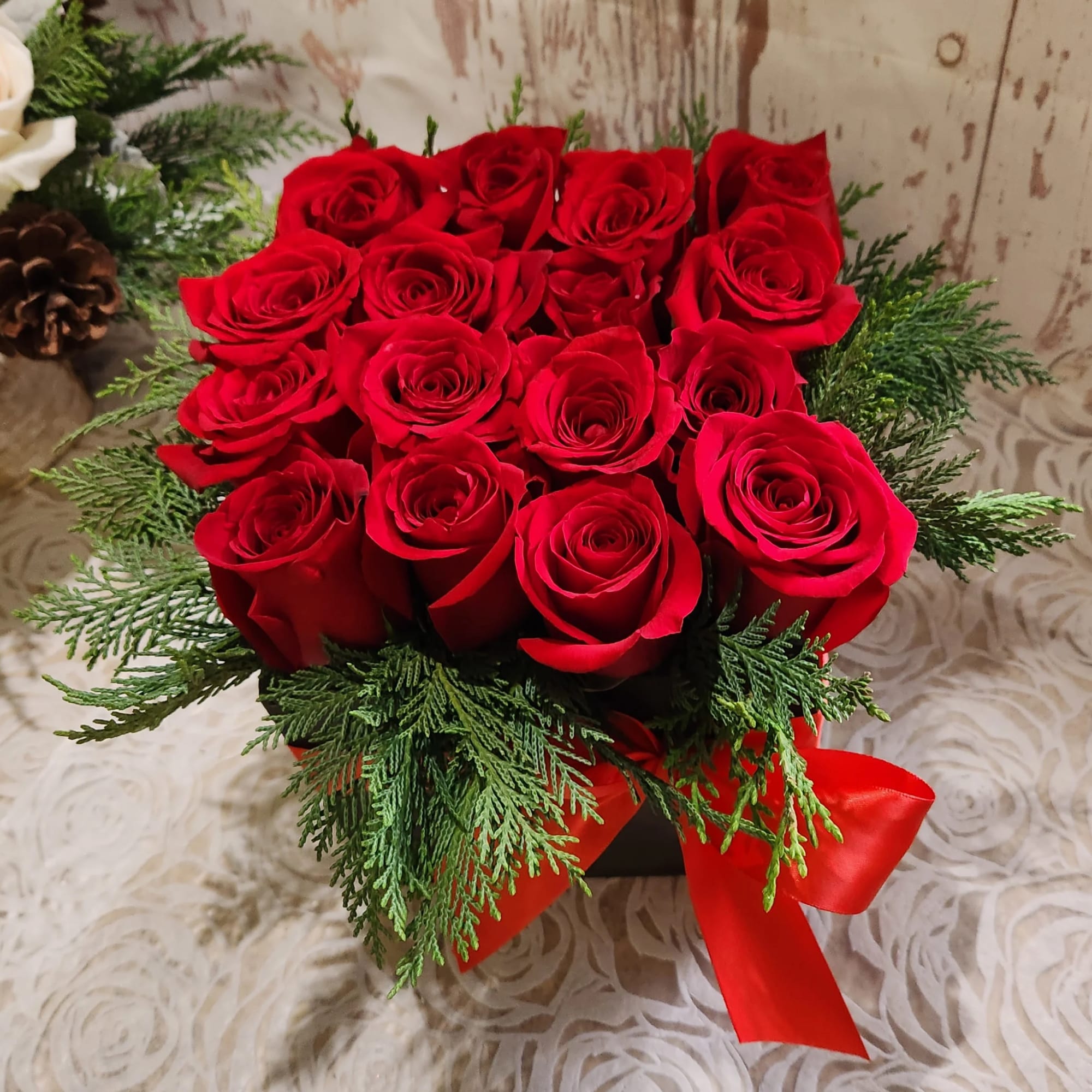 This eye-catching arrangement offers a modern twist on the classic dozen. Rustic