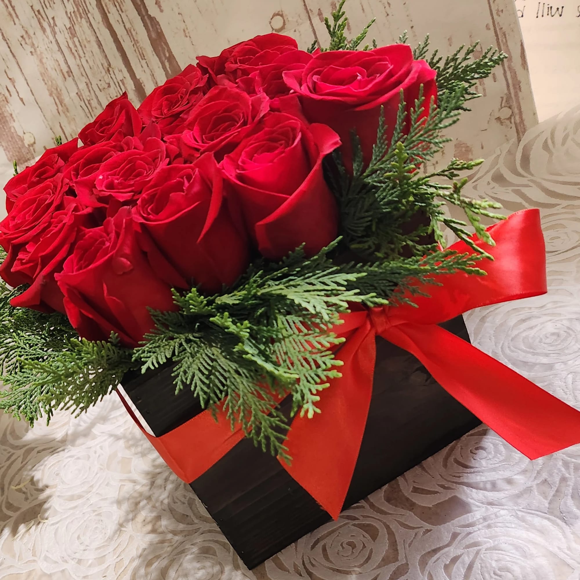 This eye-catching arrangement offers a modern twist on the classic dozen. Rustic