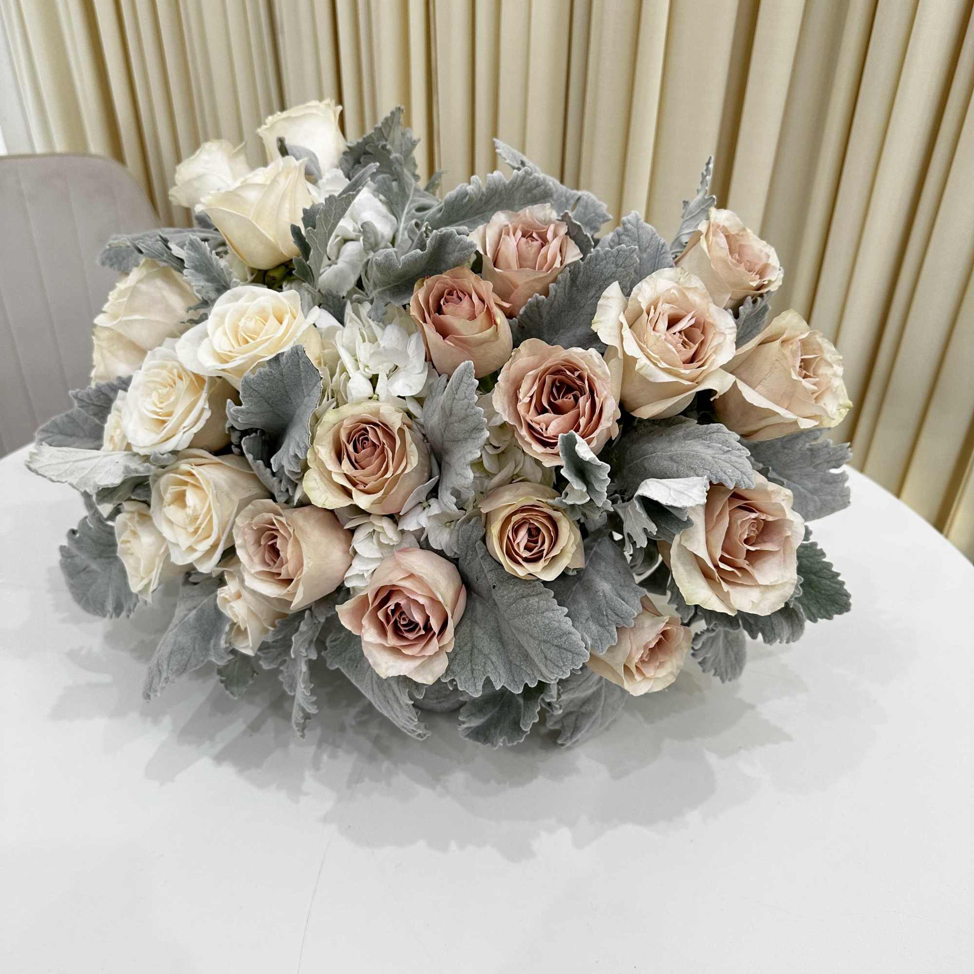 This exquisite flower arrangement, carefully curated to bring a burst of color