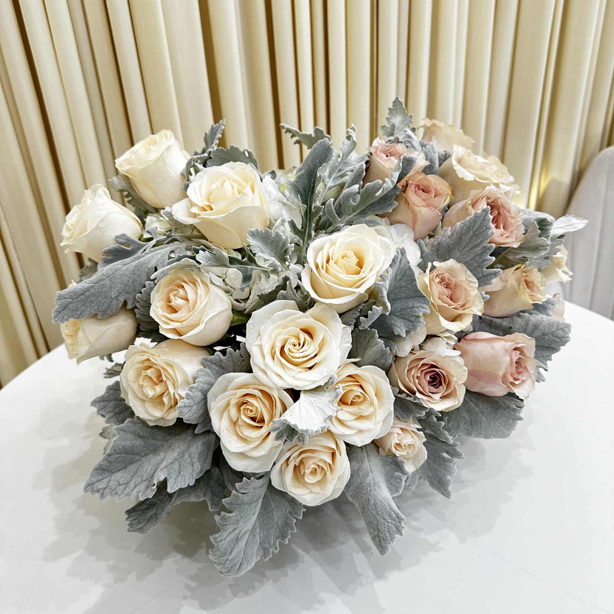 This exquisite flower arrangement, carefully curated to bring a burst of color