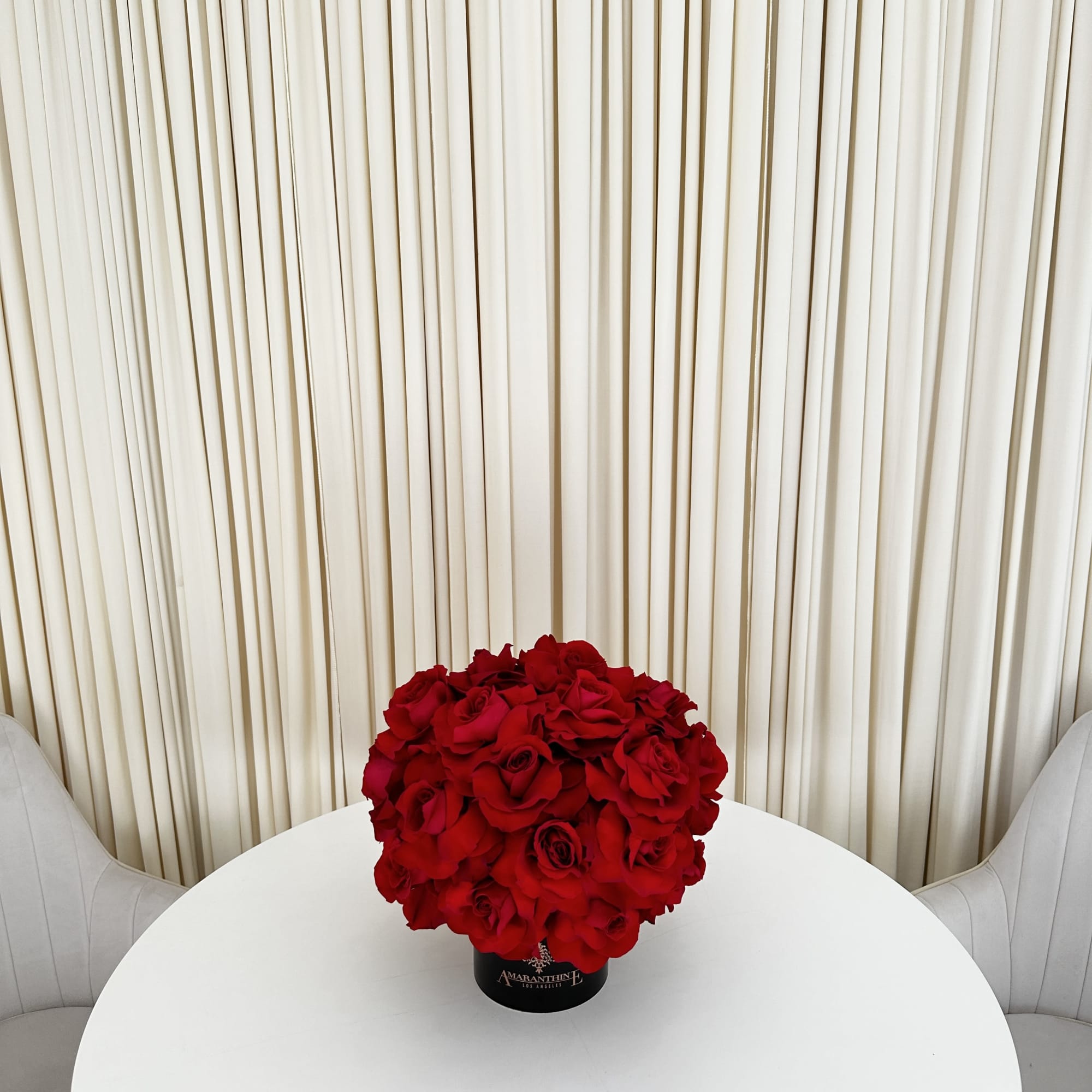 This exquisite arrangement of red roses is the epitome of elegance and