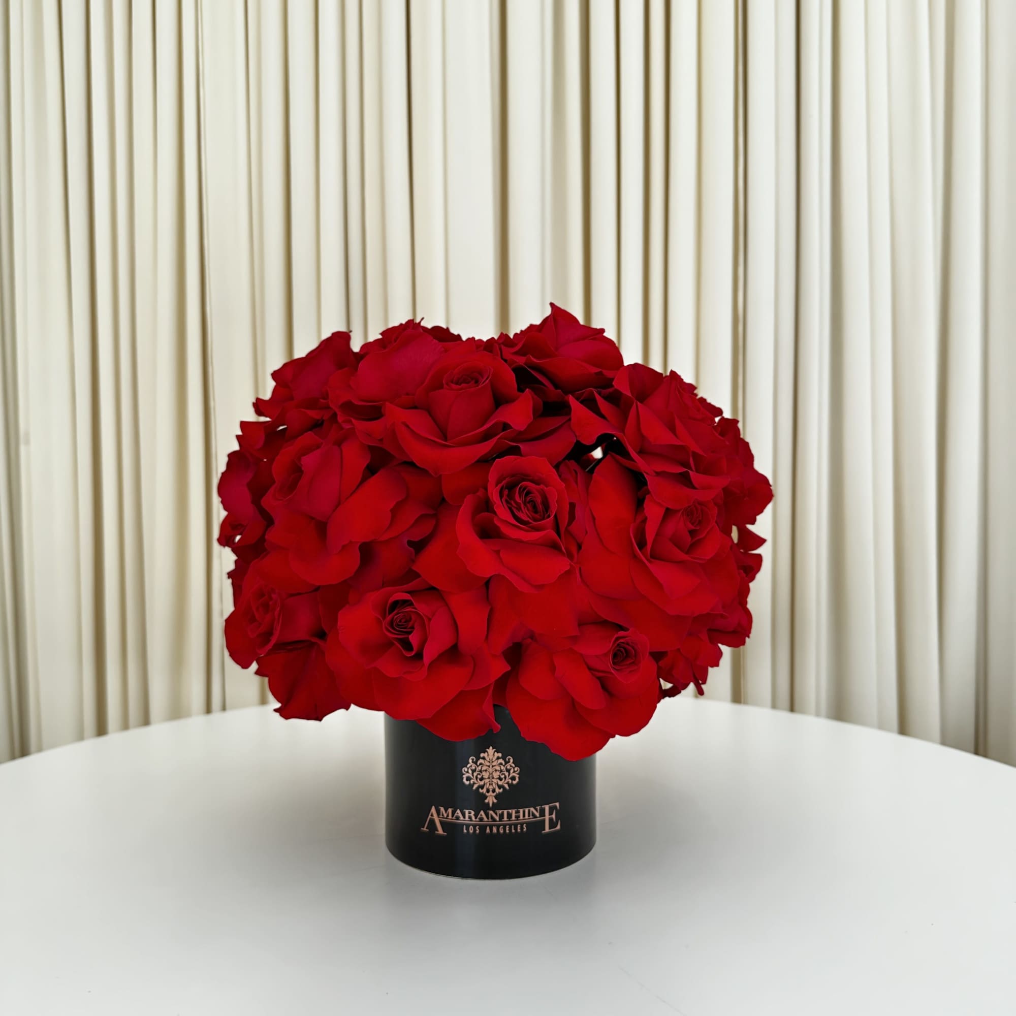 This exquisite arrangement of red roses is the epitome of elegance and