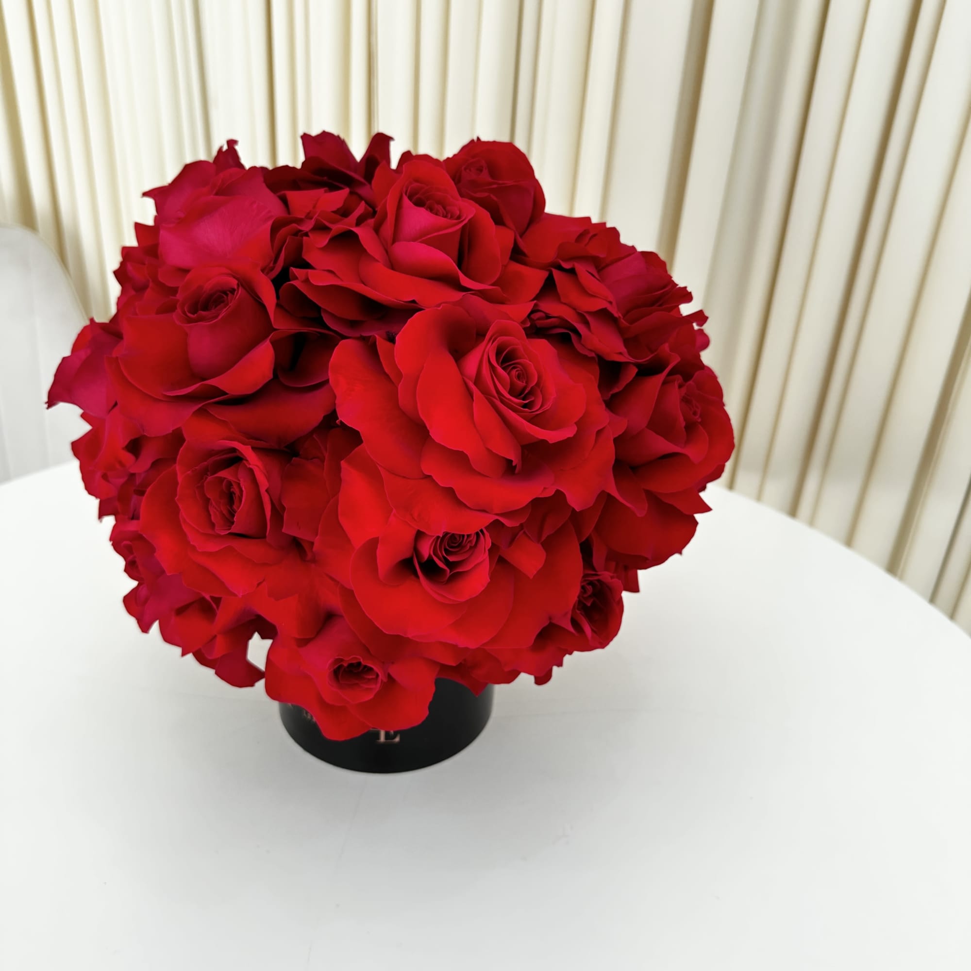 This exquisite arrangement of red roses is the epitome of elegance and