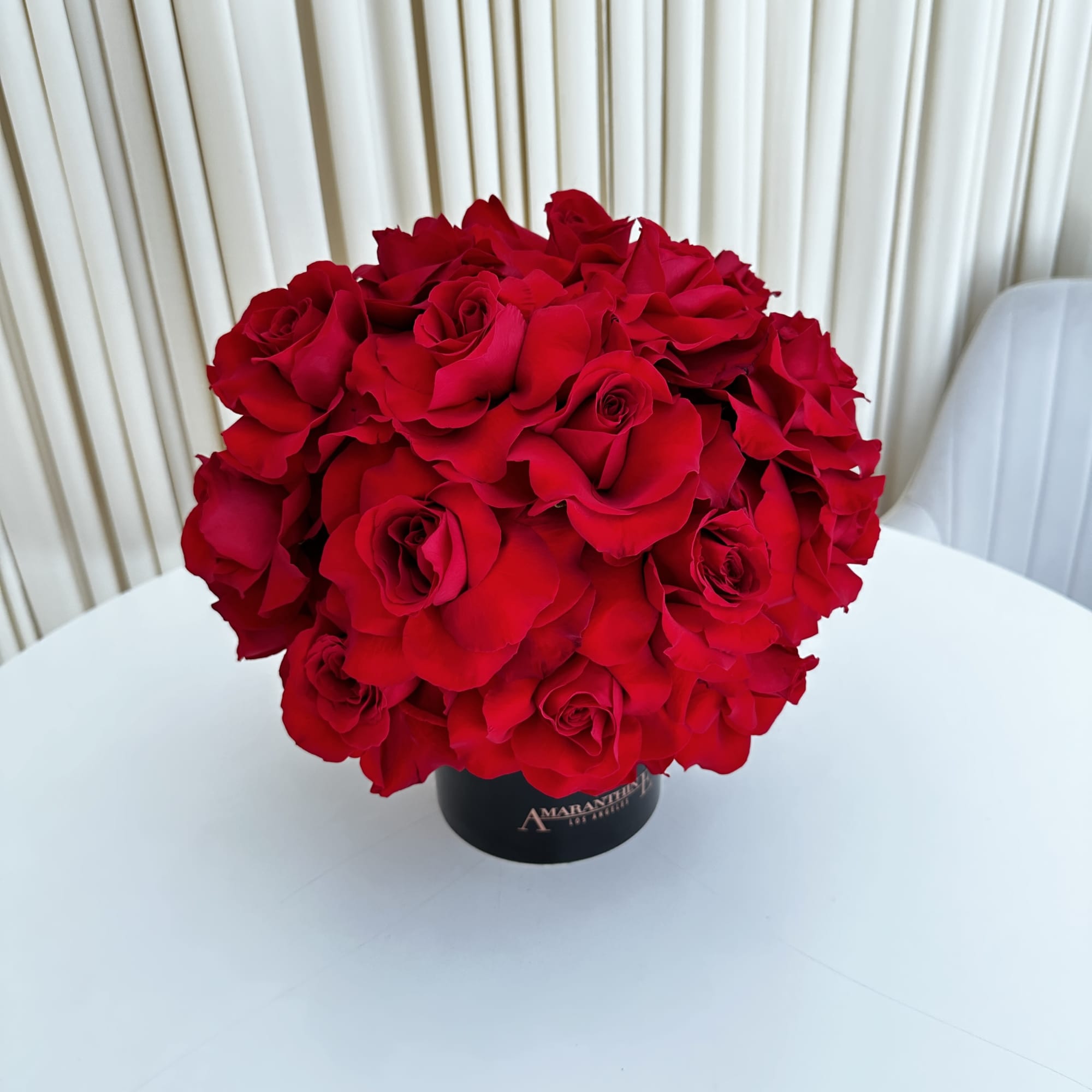 This exquisite arrangement of red roses is the epitome of elegance and