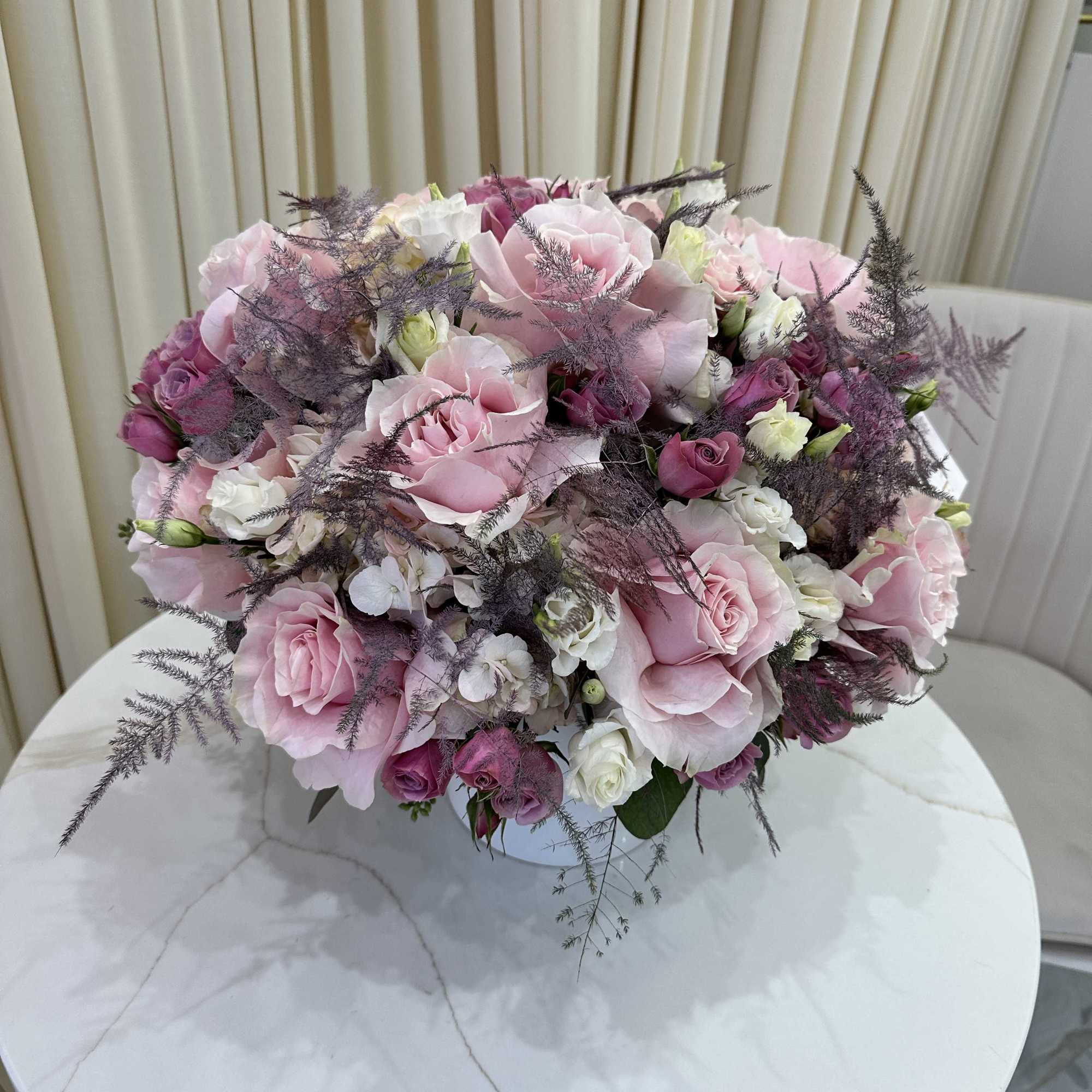 Bring a touch of springtime indoors with this cheerful arrangement of pastel-colored