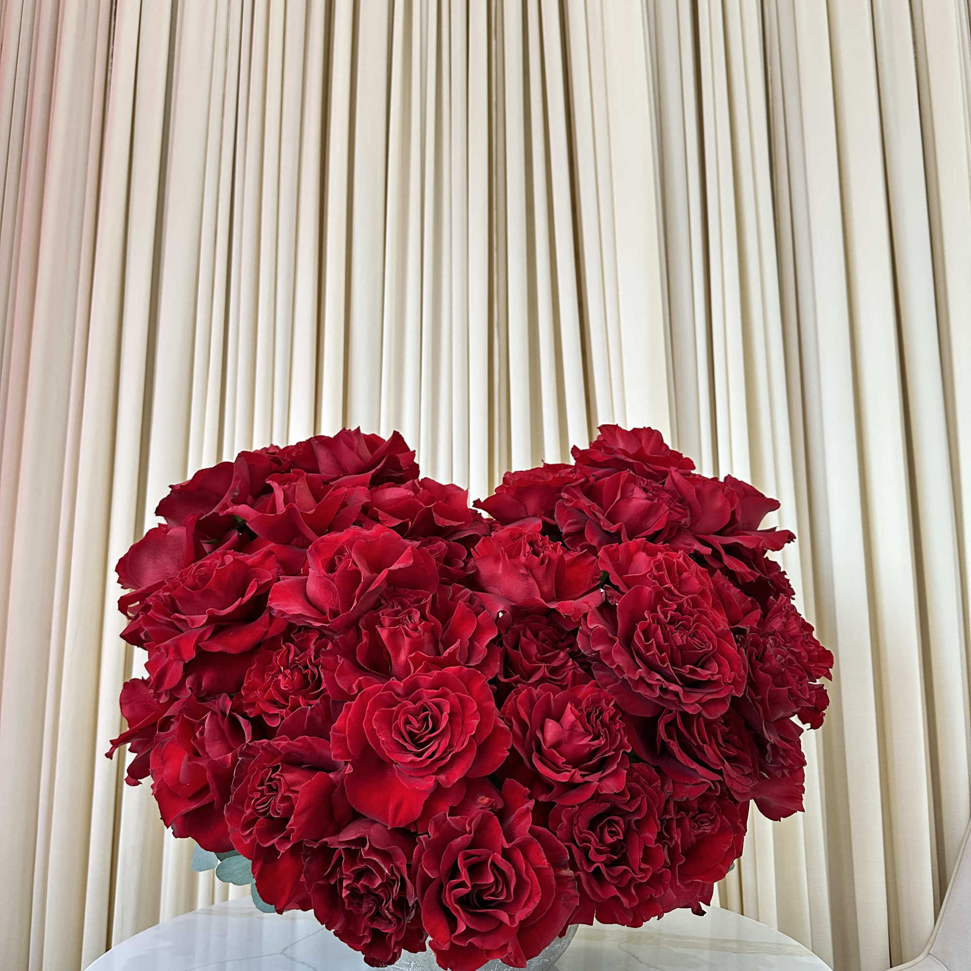 Shower your loved one with adoration with this captivating heart-shaped arrangement of