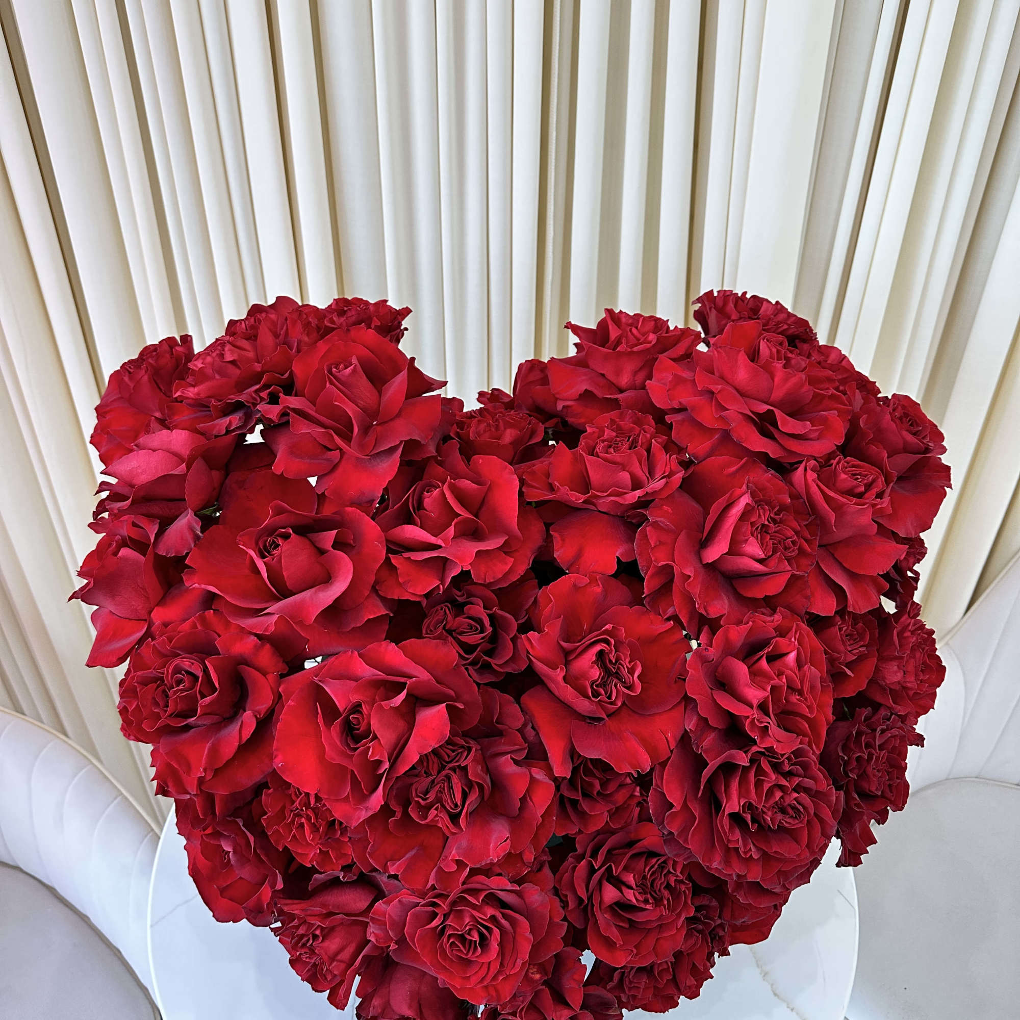 Shower your loved one with adoration with this captivating heart-shaped arrangement of