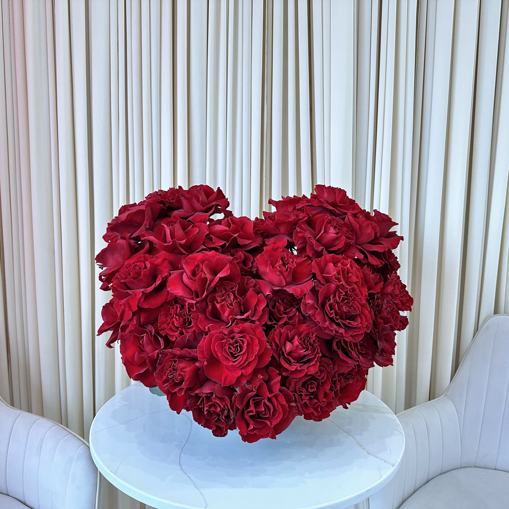 Shower your loved one with adoration with this captivating heart-shaped arrangement of