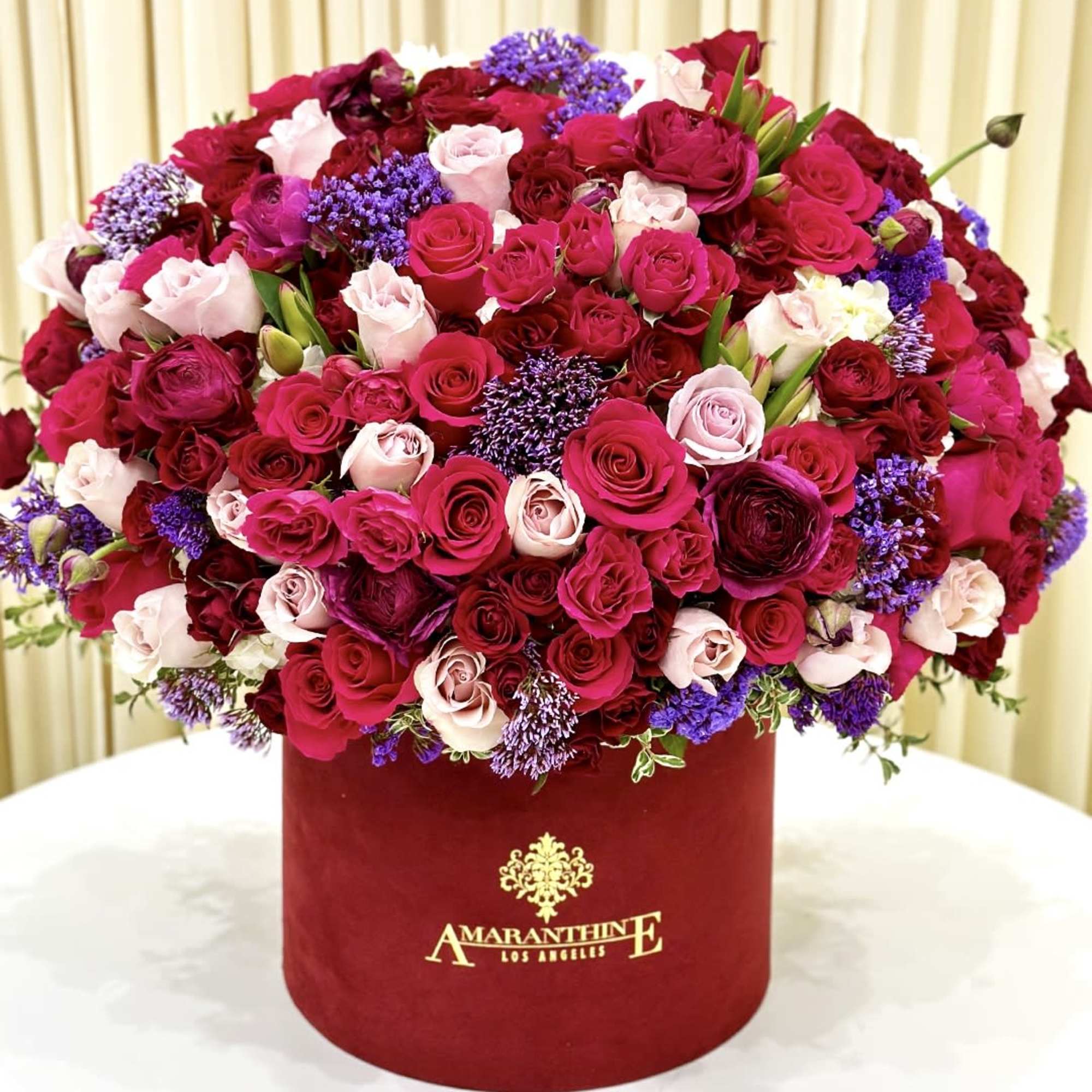 Unveil the enchantment of our &quot;Enchanted Velvet&quot; floral arrangement, presented in a