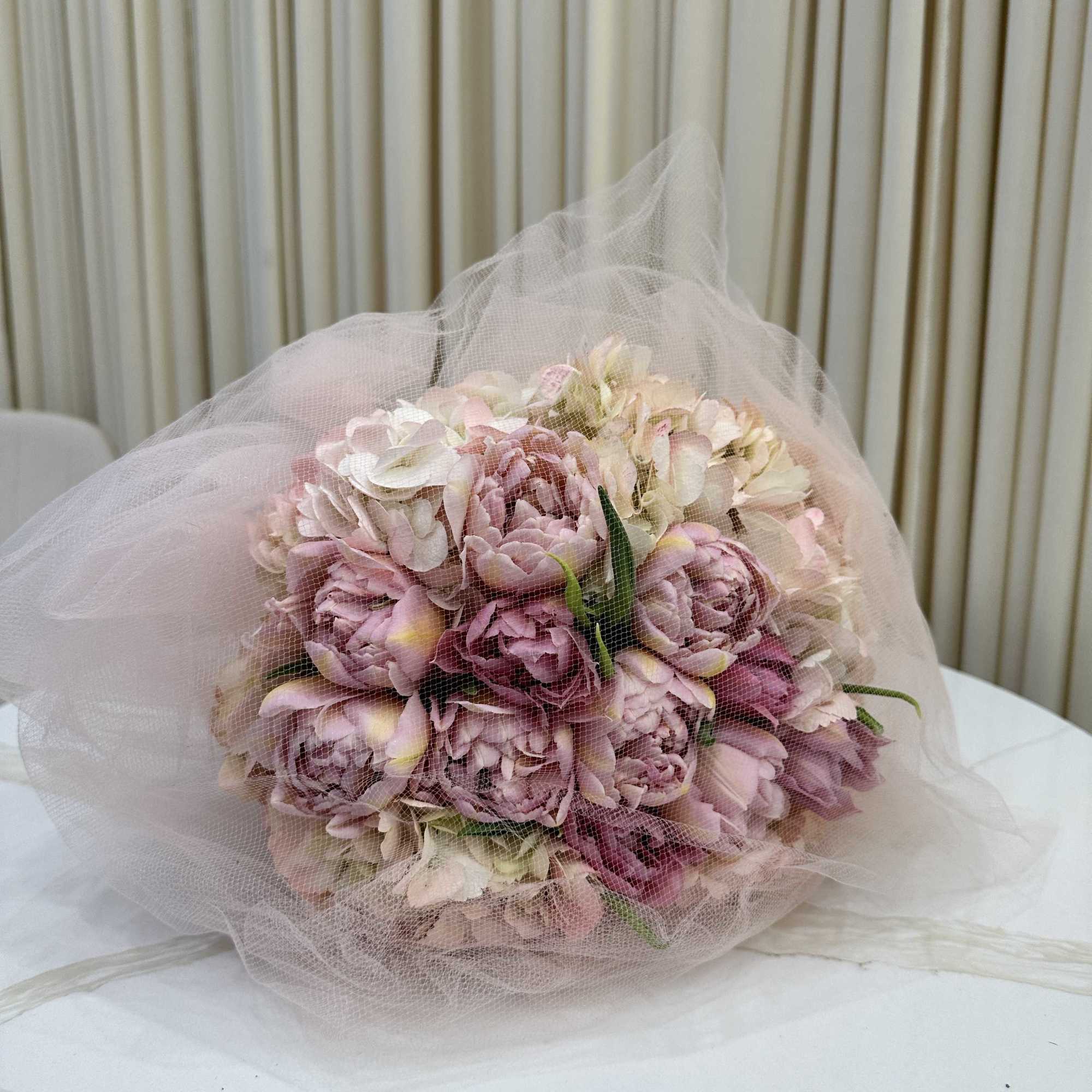 This vibrant bouquet captures the essence of spring with a delightful mix