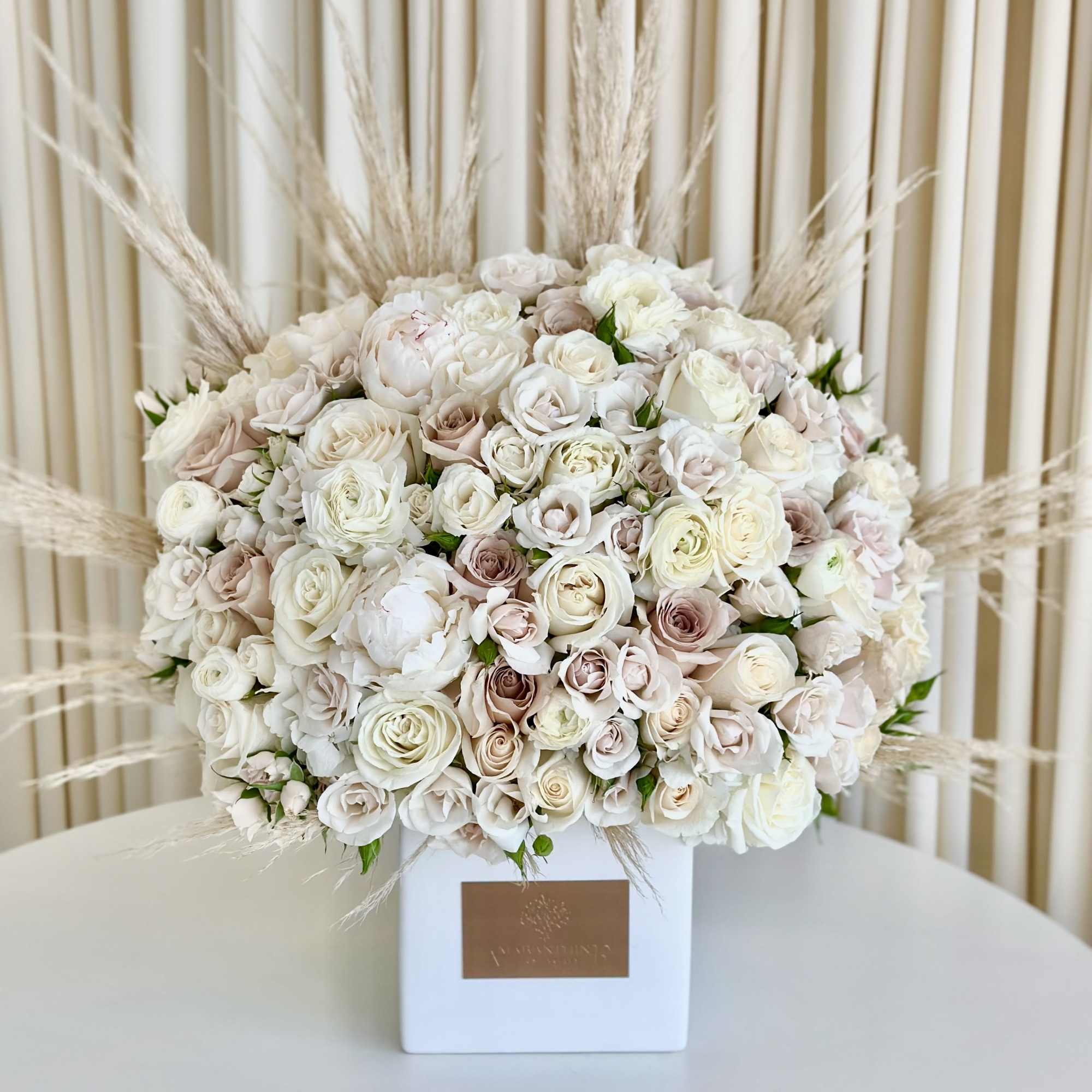 Experience the elegance of simplicity with our &quot;Charming Neutrals&quot; flower arrangement. Delicate