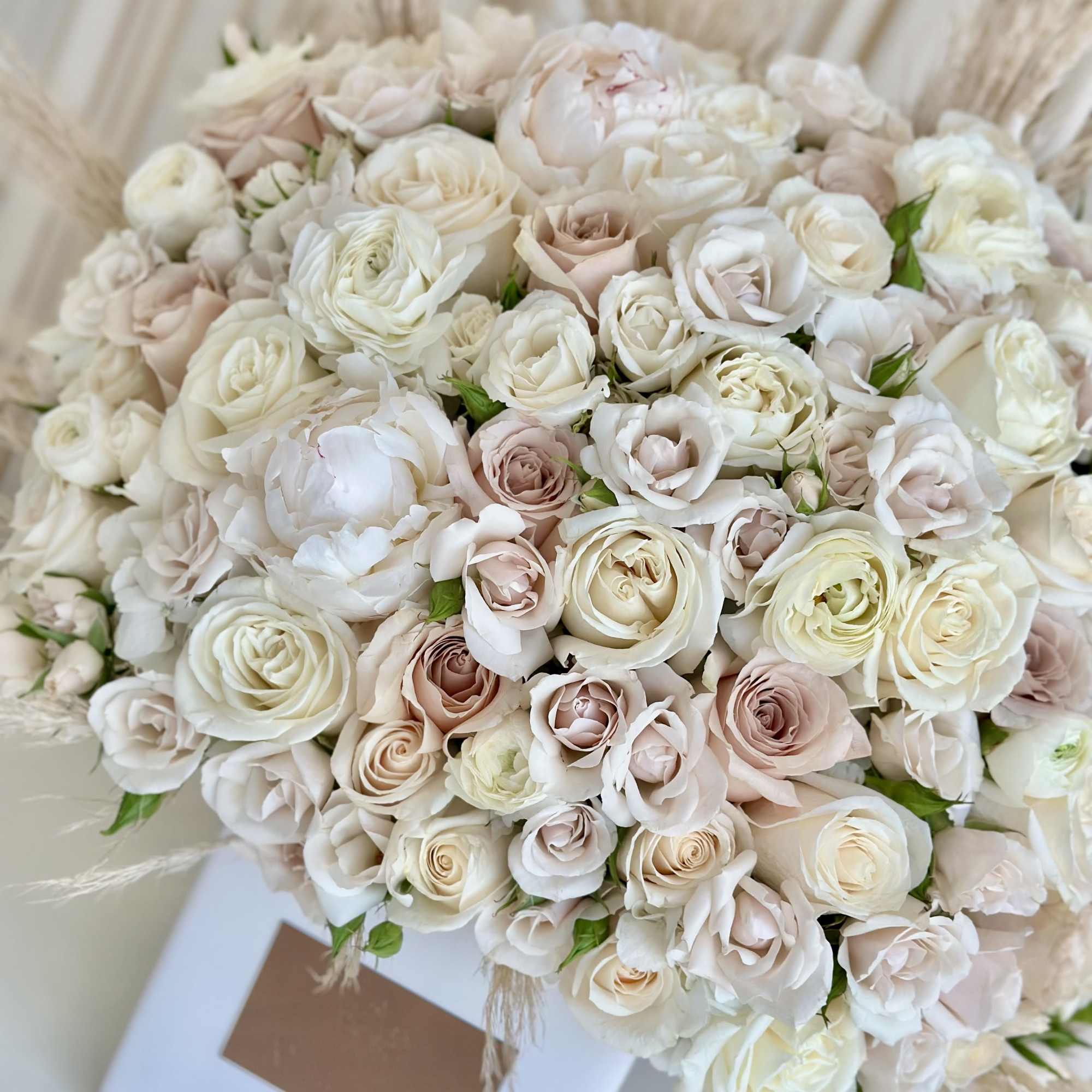 Experience the elegance of simplicity with our &quot;Charming Neutrals&quot; flower arrangement. Delicate