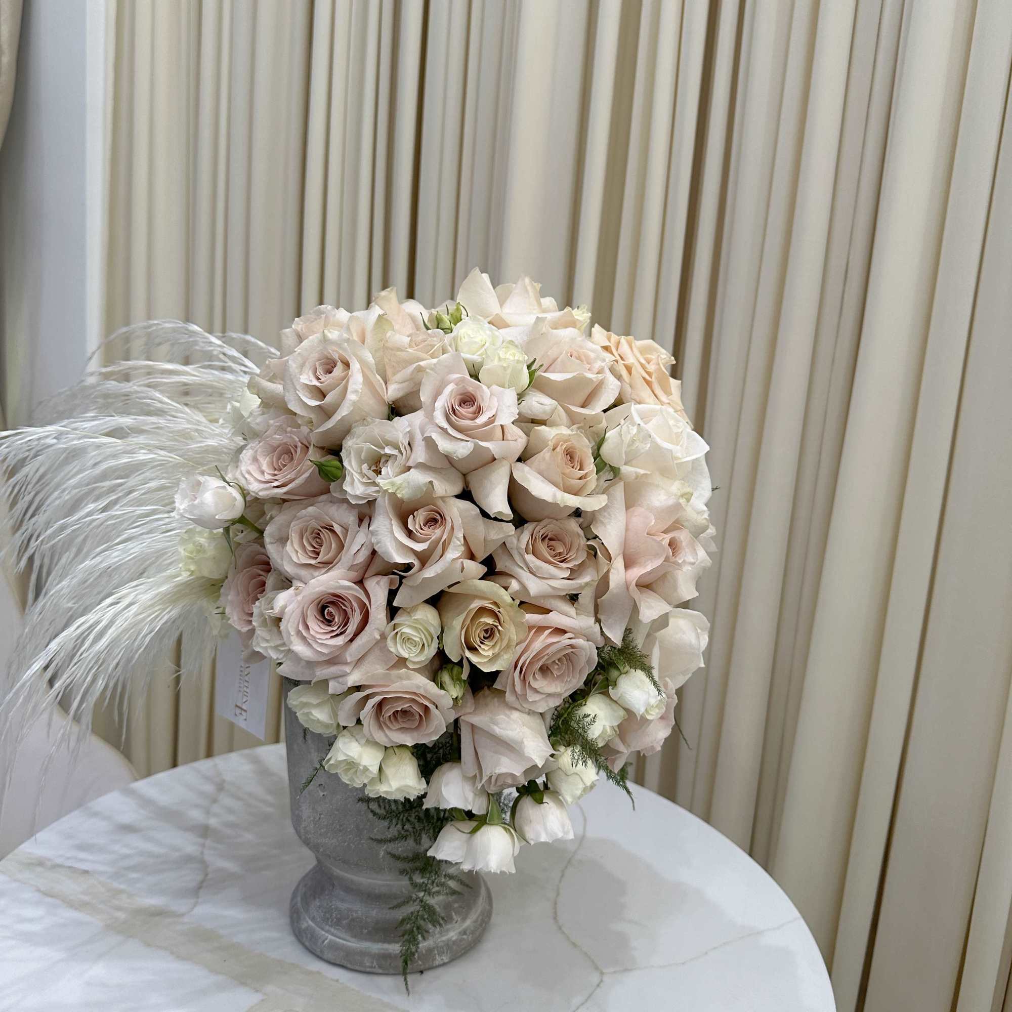 Bring the beauty of nature indoors with this stunning arrangement of ivory