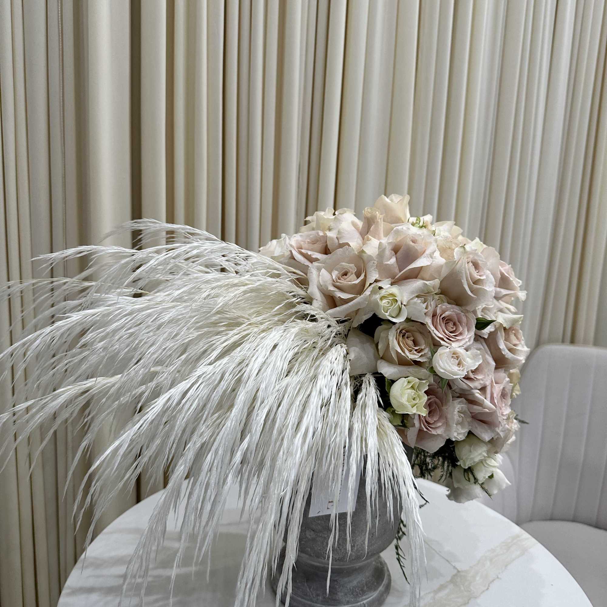 Bring the beauty of nature indoors with this stunning arrangement of ivory