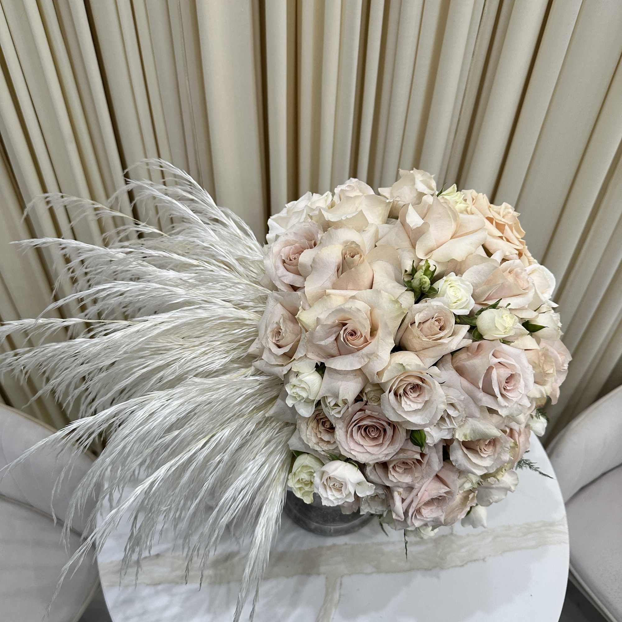 Bring the beauty of nature indoors with this stunning arrangement of ivory