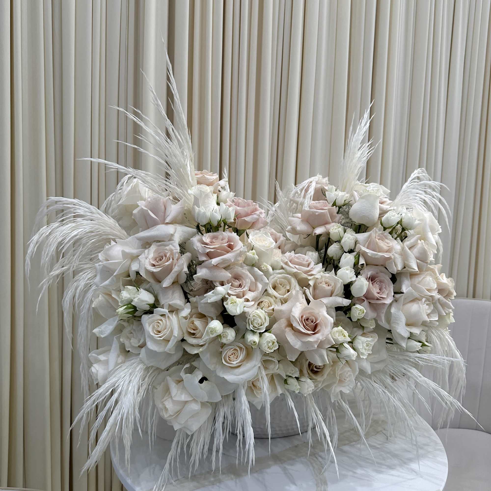 The soft, cashmere-hued blooms of this bouquet will create a feeling of