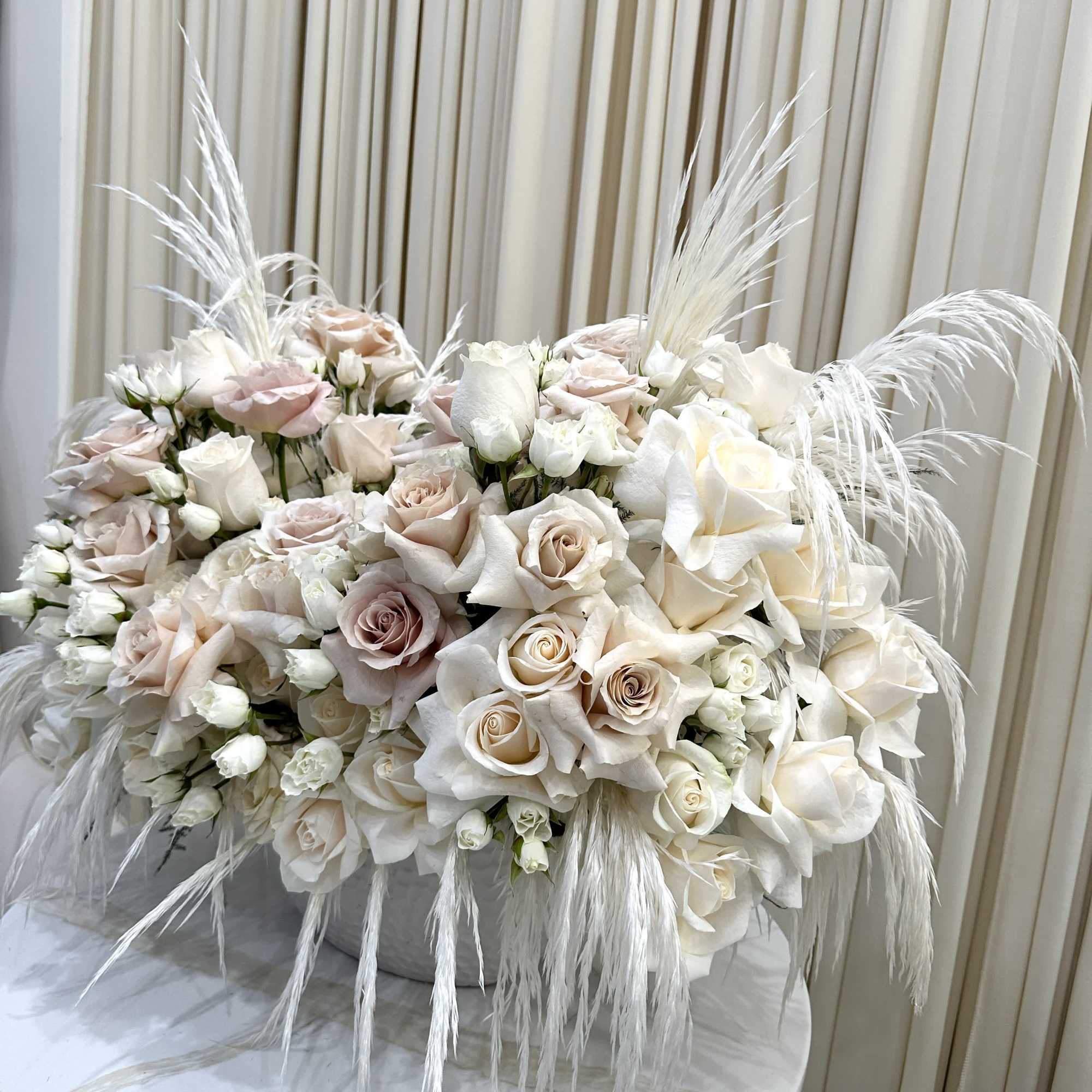 The soft, cashmere-hued blooms of this bouquet will create a feeling of