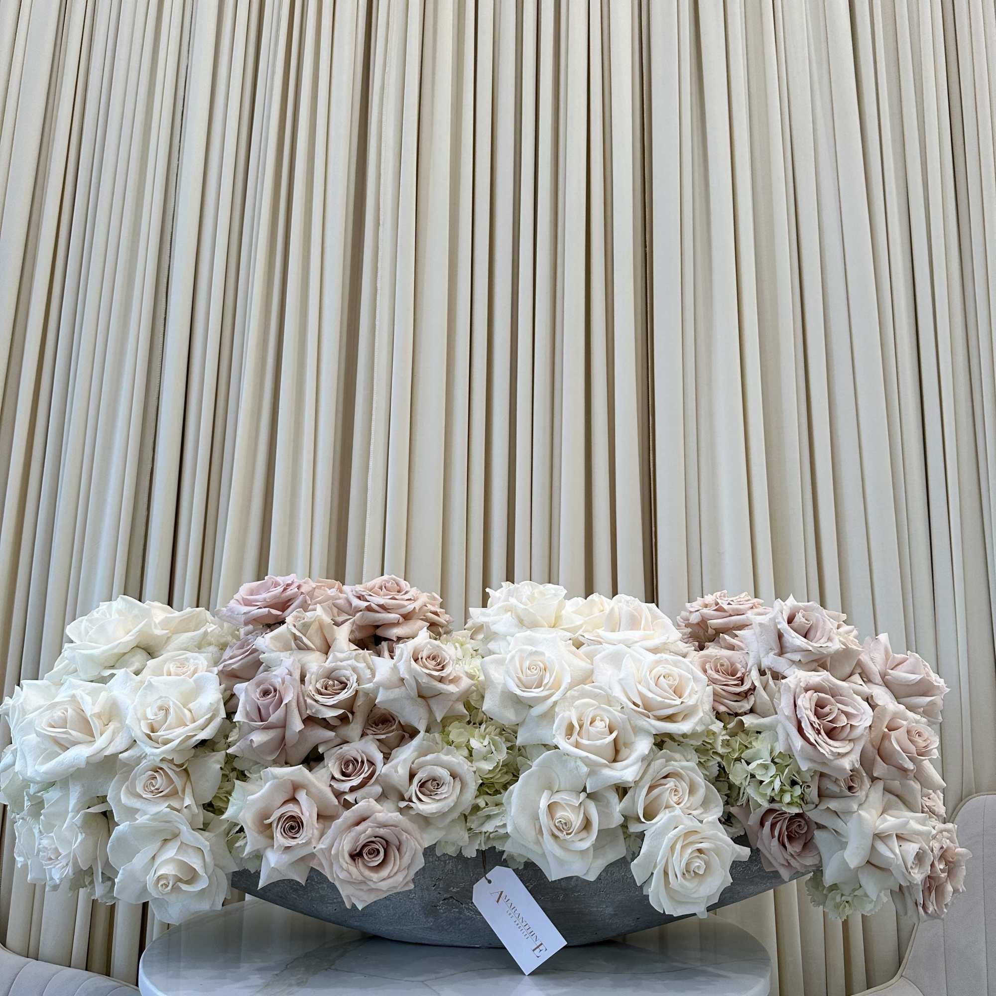 Symbolize purity and love with this classic bouquet of white and blush